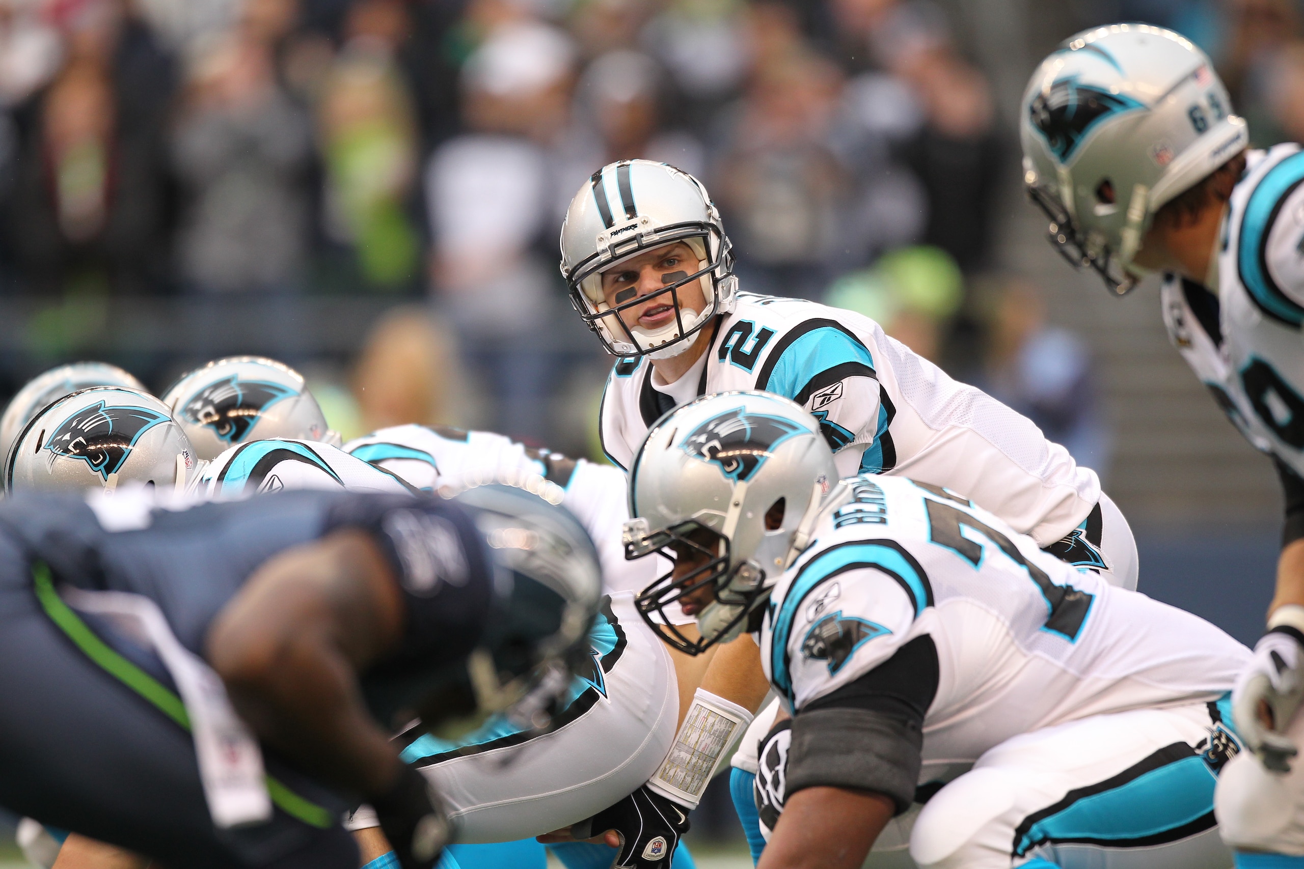 SEATTLE - DECEMBER 05:  Quarterback Jimmy Clausen #2 of the Carolina Panthers scans the field at the line of scrimmage against the Seattle Seahawks at Qwest Field on December 5, 2010 in Seattle, Washington. The Seahawks won, 31-14. (Photo by Otto Greule J