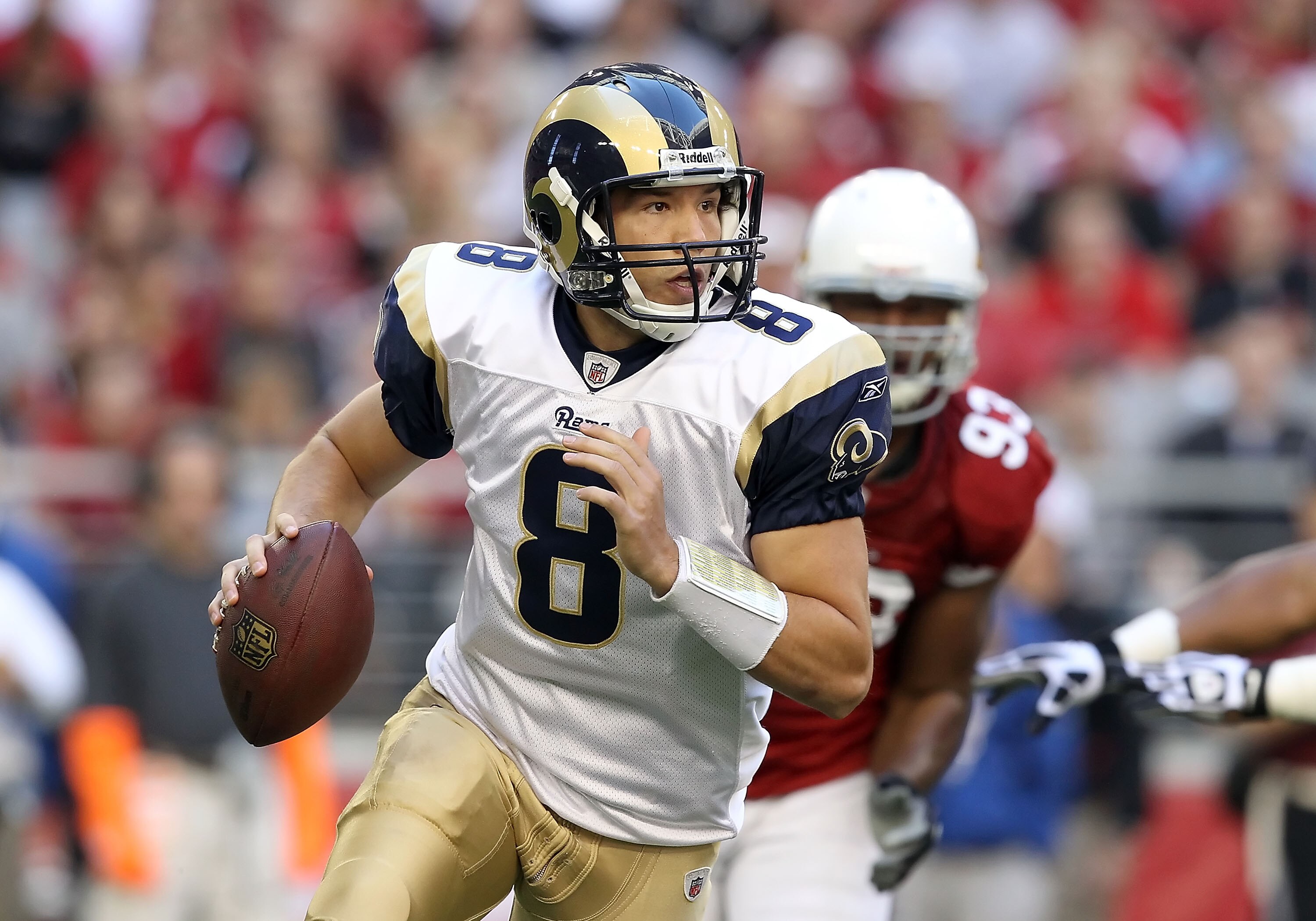 GLENDALE, AZ - DECEMBER 05: Quarterback Sam Bradford #8 of the St. Louis Rams scrambles with the football during the NFL game against the Arizona Cardinals at the University of Phoenix Stadium on December 5, 2010 in Glendale, Arizona. (Photo by Christia GLENDALE, AZ - DECEMBER 05: Quarterback Sam Bradford #8 of the St. Louis Rams scrambles with the football during the NFL game against the Arizona Cardinals at the University of Phoenix Stadium on December 5, 2010 in Glendale, Arizona. (Photo by Christia