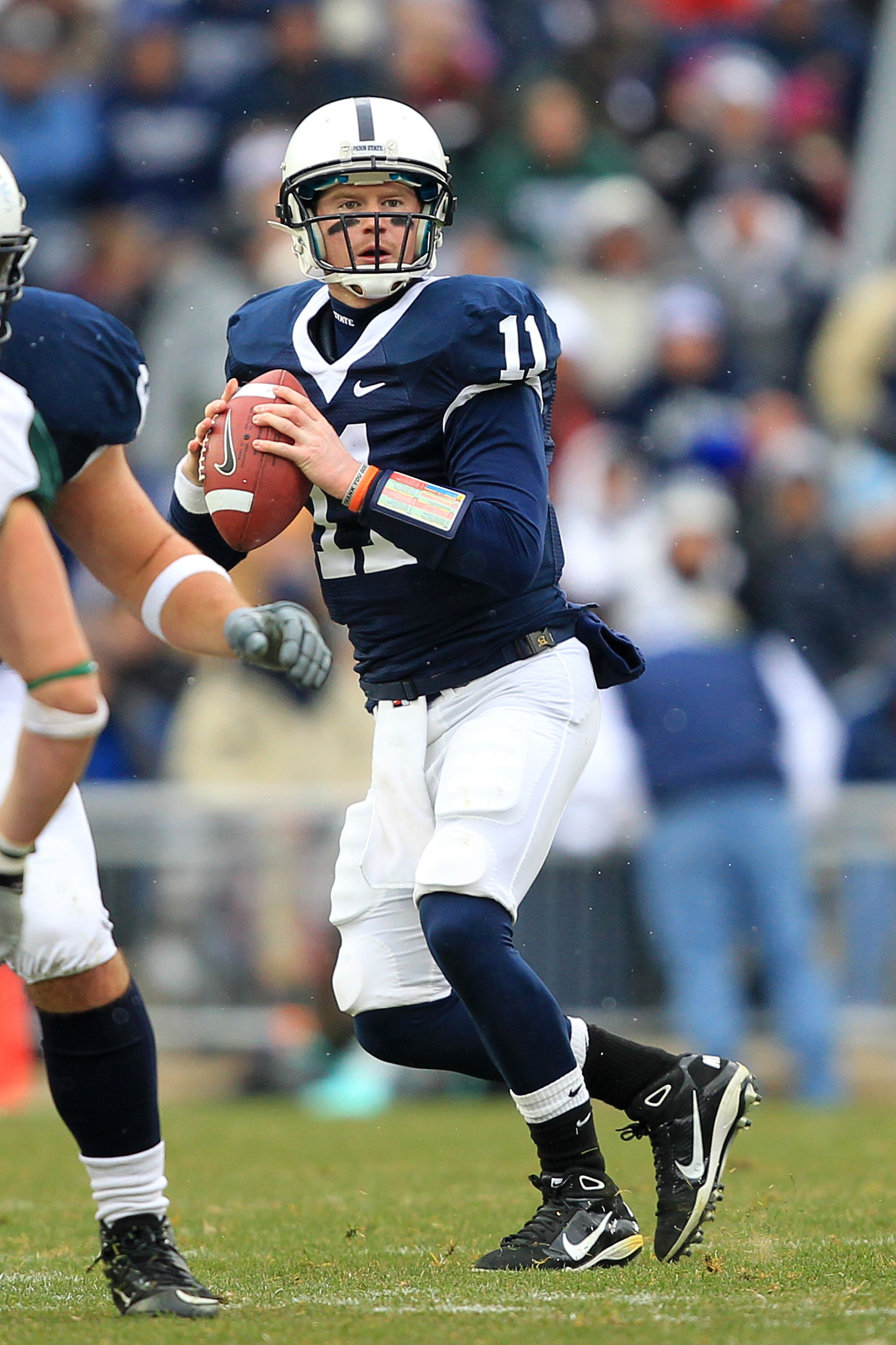 STATE COLLEGE, PA - NOVEMBER 27: Quarterback Matt McGloin #11 of the Penn State Nittany Lions drops back to pass during a game against the Michigan State Spartans on November 27, 2010 at Beaver Stadium in State College, Pennsylvania. The Spartans won 28-2