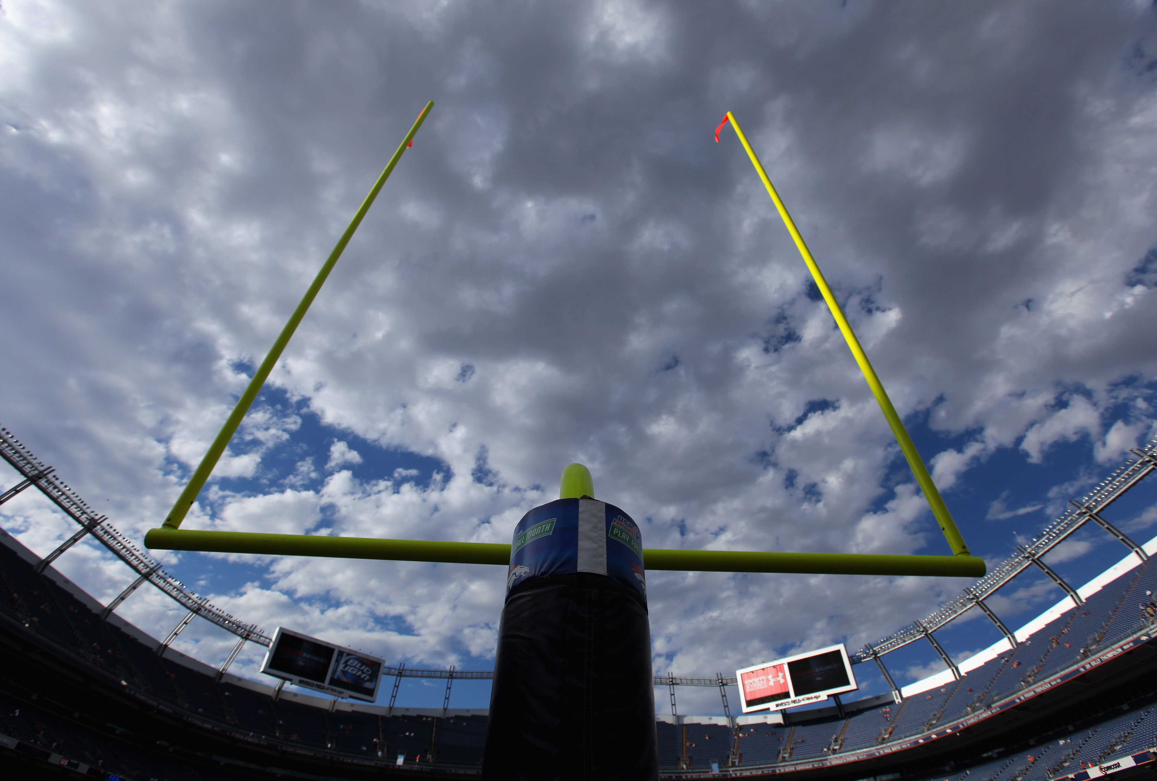 DENVER - AUGUST 21:  The goal posts on the south end of the field aim skyward as clouds filter the fading sun as the Denver Broncos host the Detroit Lions during preseason NFL action at INVESCO Field at Mile High on August 21, 2010 in Denver, Colorado.  (