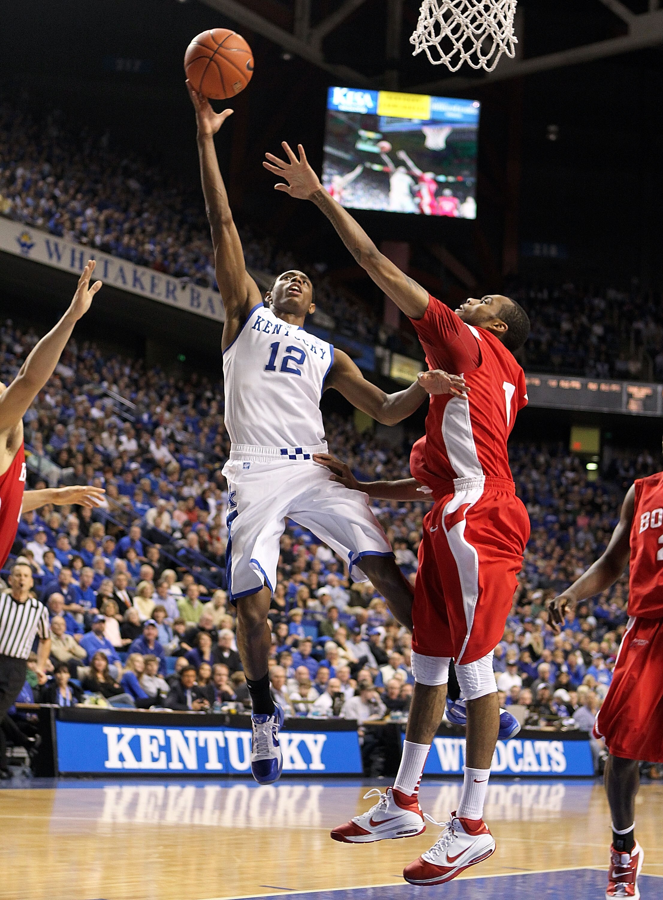 LEXINGTON, KY - NOVEMBER 30:  Brandon Knight #12 of the Kentucky Wildcats shoots the ball while defended by Darryl Partin #1 of the Boston University Terriers during the game on November 30, 2010 in Lexington, Kentucky.  (Photo by Andy Lyons/Getty Images)