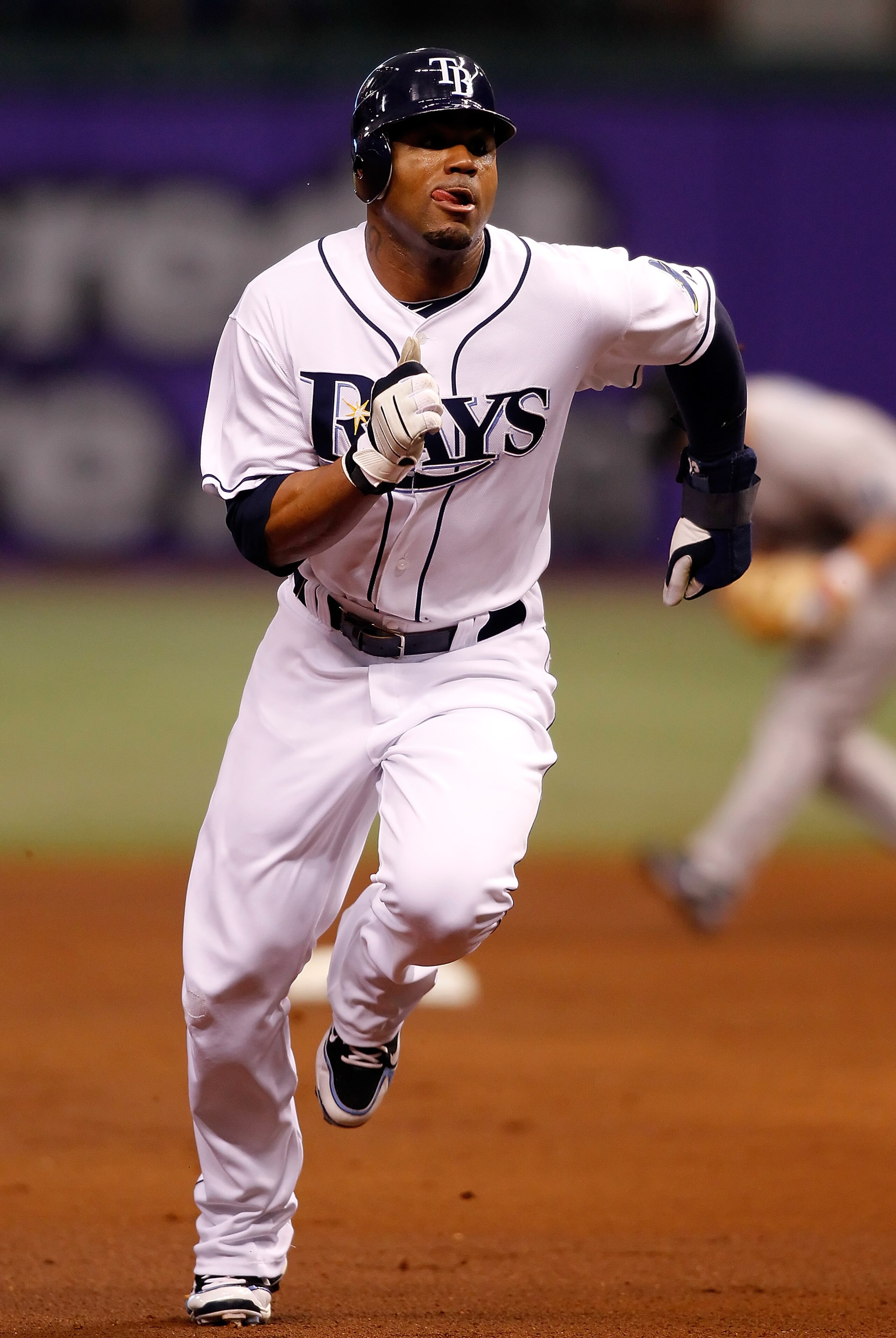 ST PETERSBURG, FL - APRIL 24:  Outfielder Carl Crawford #13 of the Tampa Bay Rays advances against the Toronto Blue Jays during the game at Tropicana Field on April 24, 2010 in St. Petersburg, Florida.  (Photo by J. Meric/Getty Images)