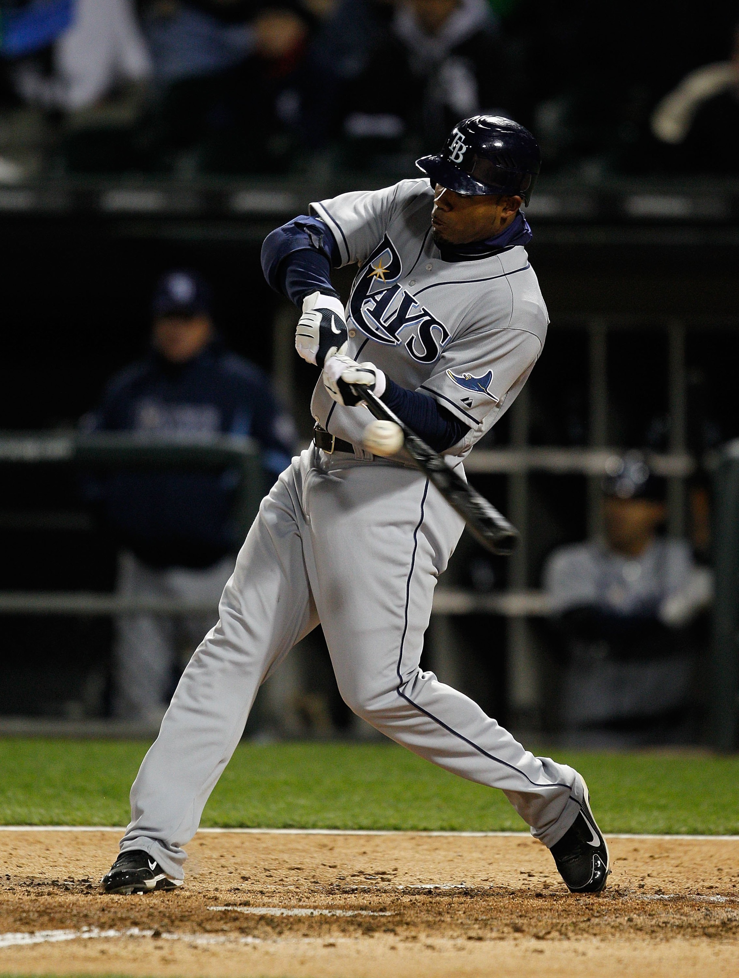 CHICAGO - APRIL 21: Carl Crawford #13 of the Tampa Bay Rays hits the ball against the Chicago White Sox at U.S. Cellular Field on April 21, 2010 in Chicago, Illinois. The Rays defeated the White Sox 12-0. (Photo by Jonathan Daniel/Getty Images)