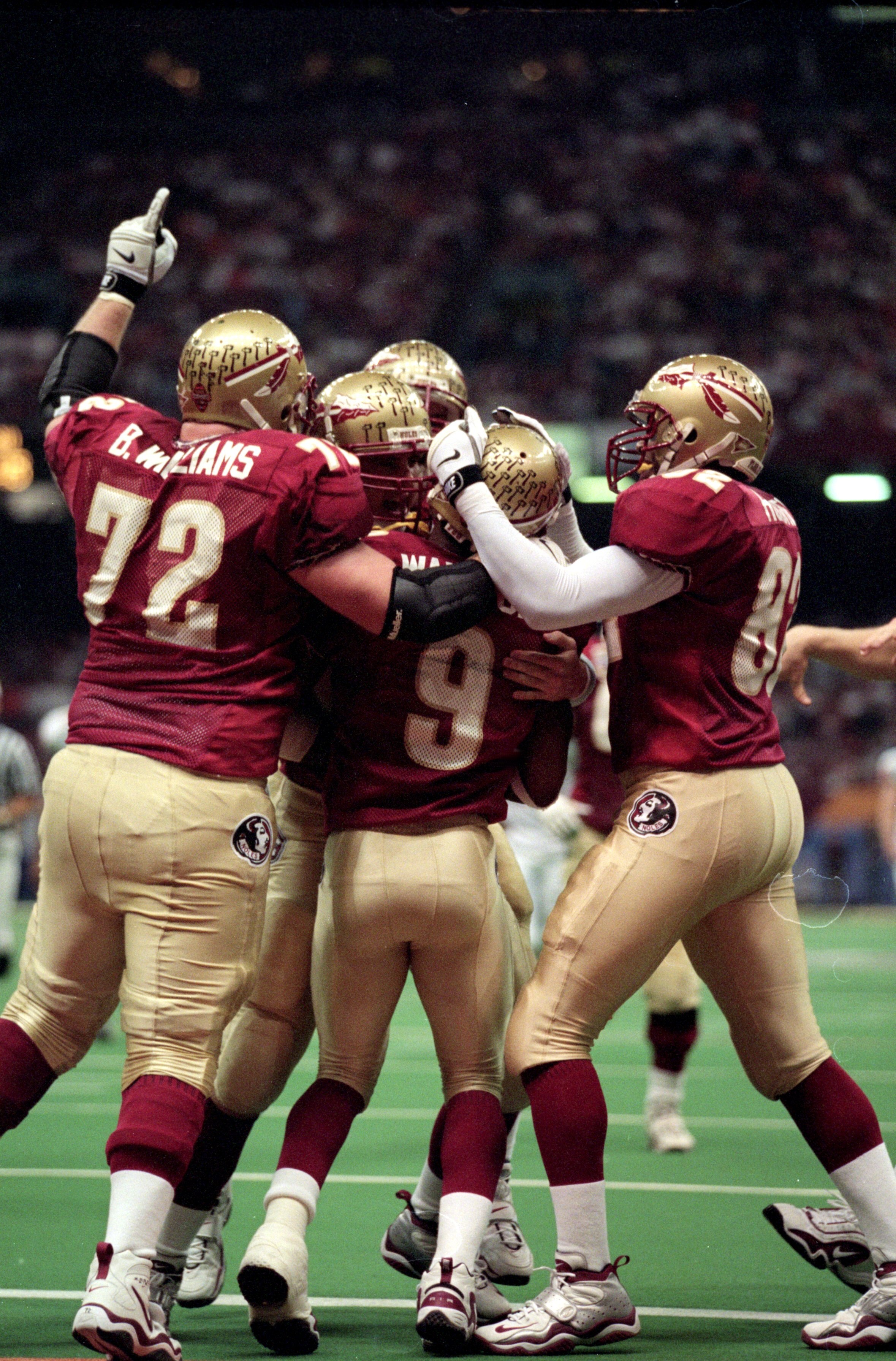 5 Jan 2000: Peter Warrick #9 of the Florida State Seminoles celebrates his touchdown with teammates on the field during the Nokita Sugar Bowl Game against the Virginia Tech Hokies at the Louisiana Superdome in New Orleans, Louisiana. The Seminoles defeate