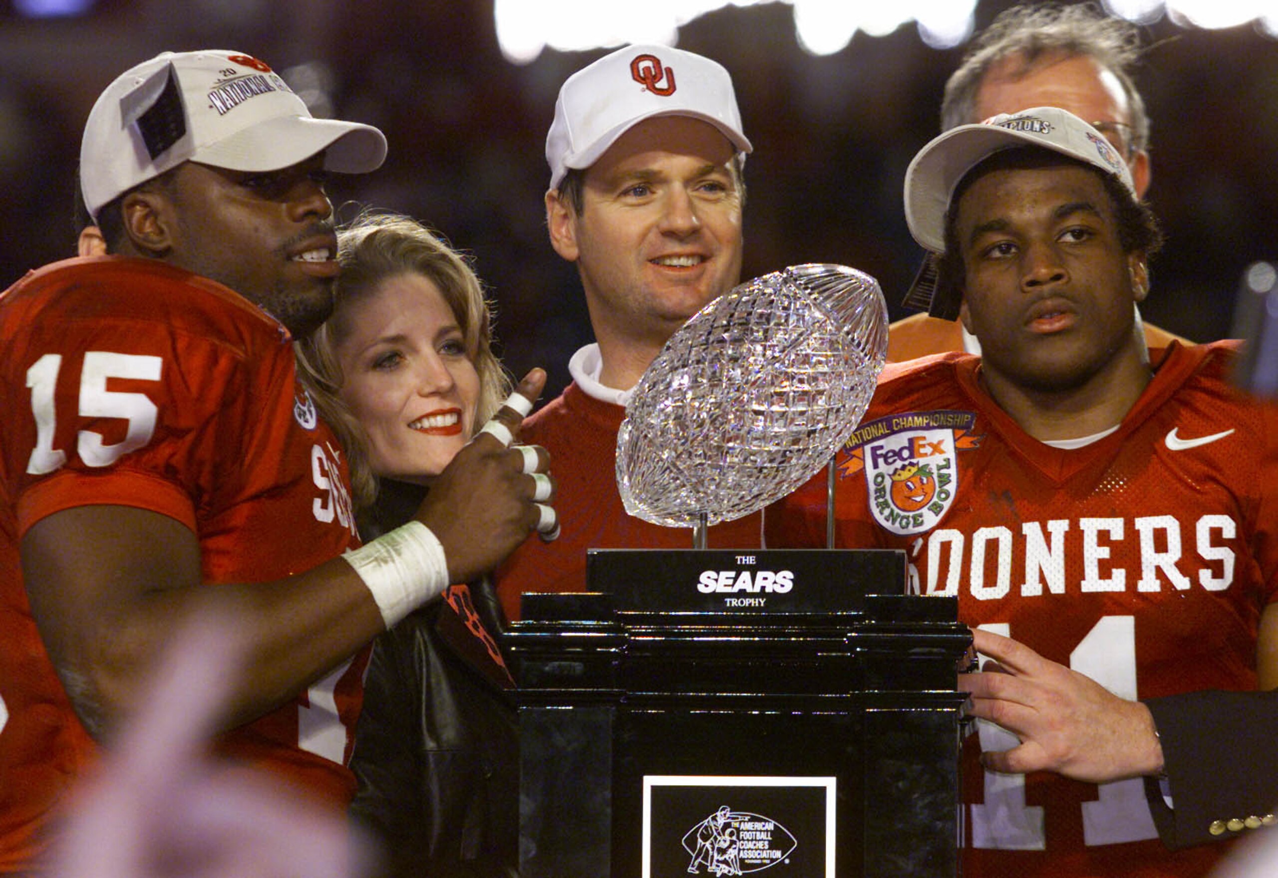 3 Jan 2001:  Head Coach Bob Stoops, J.T. Thatcher #15 and Ontei Jones #11 of the Oklahoma Sooners celebrate after defeating the Florida State Seminoles 13-2 to win the Orange Bowl at Pro Player Stadium in Miami, Florida. DIGITAL IMAGE Mandatory Credit: Br