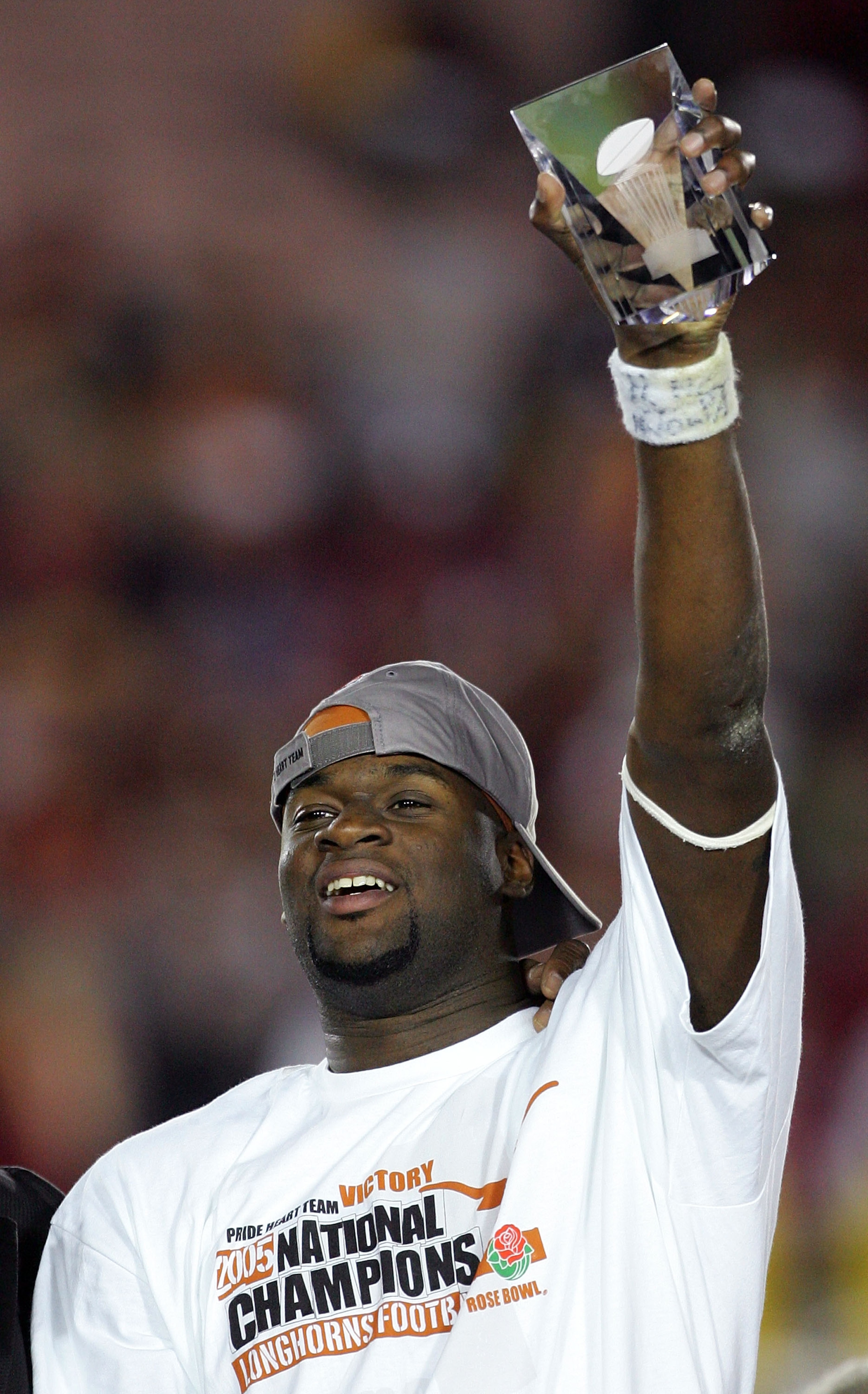 PASADENA, CA - JANUARY 04:  Quarterback Vince Young #10 of the Texas Longhorns holds up the award for offensive player of the game after defeating the USC Trojans in the final moments of the BCS National Championship Rose Bowl Game at the Rose Bowl on Jan
