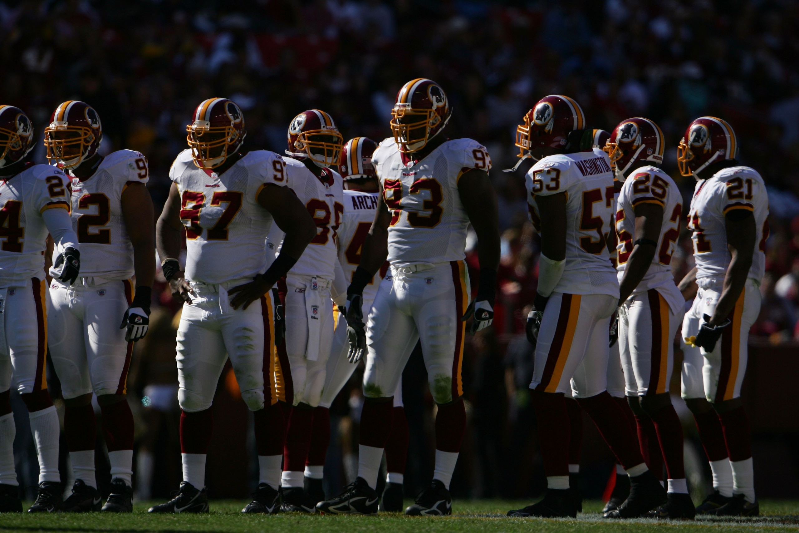 WASHINGTON ? OCTOBER 15:  Defensive end Phillip Daniels #93 of the Washington Redskins huddles with his teammates during the game against the Tennessee Titans on October 15, 2006 at FedExField in Landover, Maryland. The Titans won 25-22.  (Photo by Chris