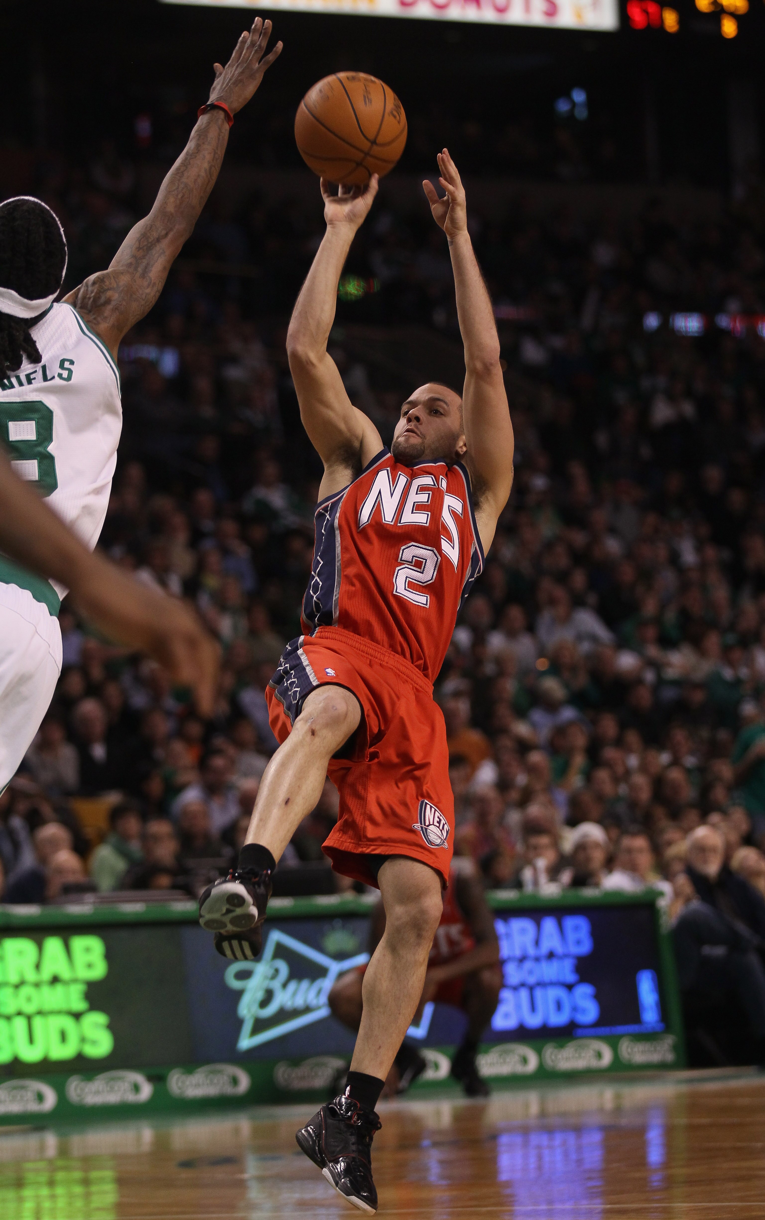 BOSTON - NOVEMBER 24:  Jordan Farmar #2 of the New Jersey Nets takes a shot as Marquis Daniels #8 of the Boston Celtics defends on November 24, 2010 at the TD Garden in Boston, Massachusetts. The Celtics defeated the nets 89-83. NOTE TO USER: User express