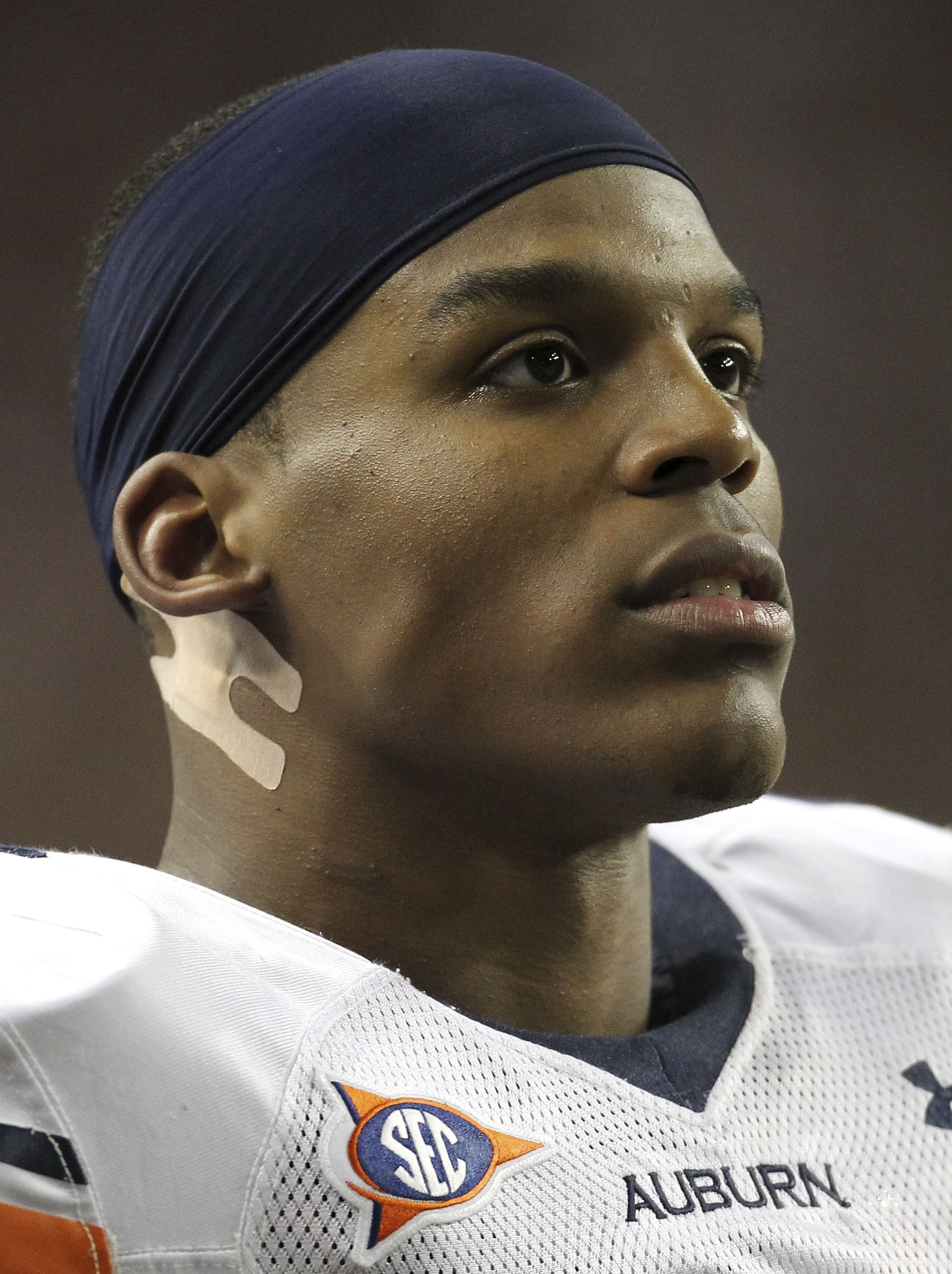 ATLANTA - DECEMBER 04:  Quarterback Cam Newton #2 of the Auburn Tigers watches the action on the scoreboard during the 2010 SEC Championship against the South Carolina Gamecocks at Georgia Dome on December 4, 2010 in Atlanta, Georgia.  (Photo by Mike Zarr