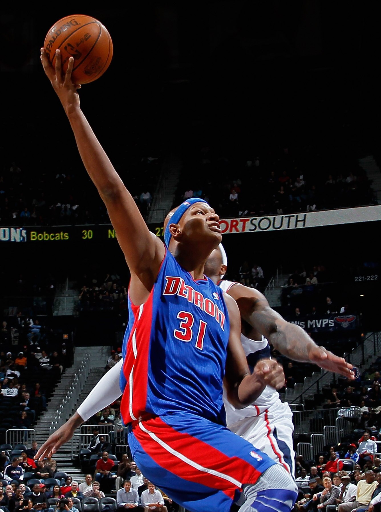 ATLANTA - NOVEMBER 03:  Charlie Villanueva #31 of the Detroit Pistons drives to the basket against Josh Smith #5 of the Atlanta Hawks at Philips Arena on November 3, 2010 in Atlanta, Georgia.  NOTE TO USER: User expressly acknowledges and agrees that, by