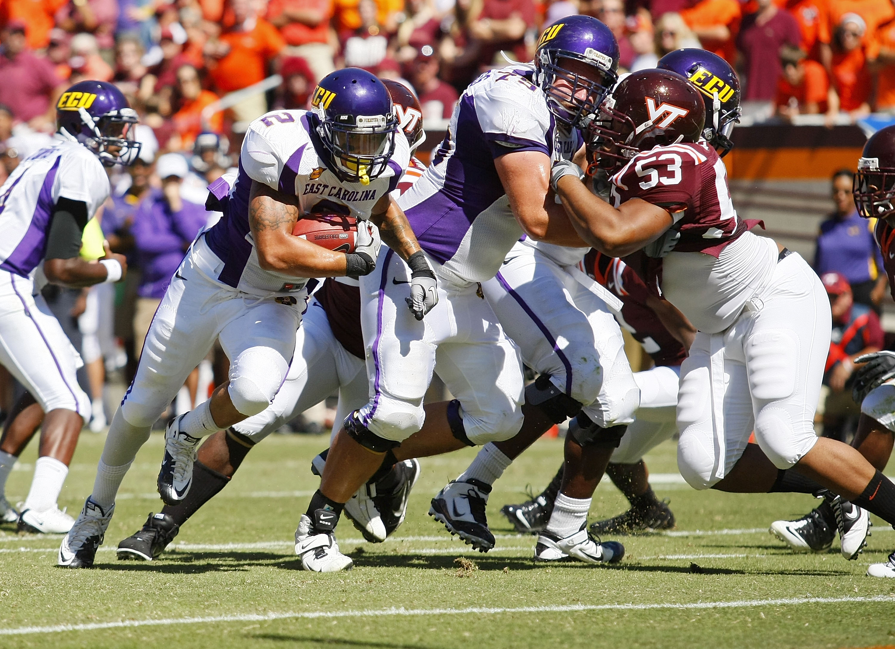 BLACKSBURG, VA - SEPTEMBER 18:  Running back Giavanni Ruffin #1 of the East Carolina Pirates runs with the ball for a touchdown past defensive tackle Dwight Tucker #53 of the Virginia Tech Hokies at Lane Stadium on September 18, 2010 in Blacksburg, Virgin