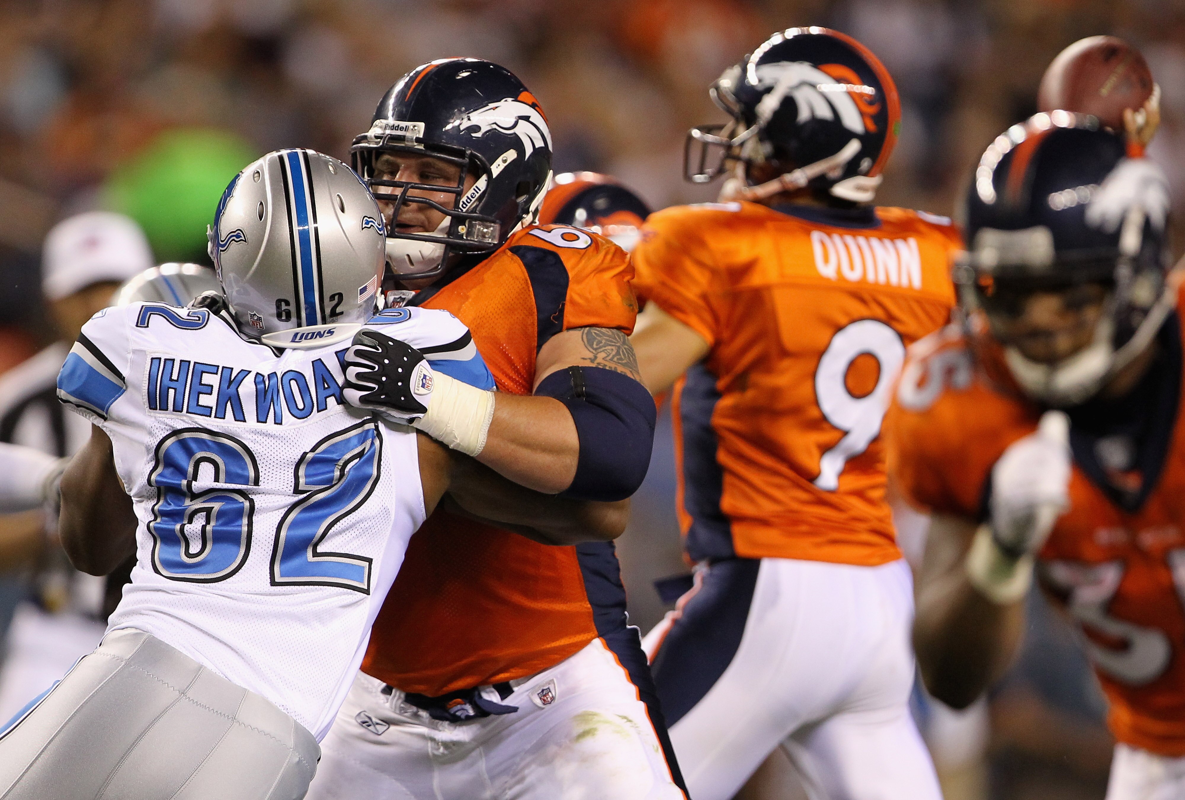 DENVER - AUGUST 21: Rookie offensive guard Zane Beadles #68 of the Denver Broncos blocks Chima Ihekwoaba of the Detroit Lions as he protects quarterback Brady Quinn #9 during preseason NFL action at INVESCO Field at Mile High on August 21, 2010 in Denver DENVER - AUGUST 21: Rookie offensive guard Zane Beadles #68 of the Denver Broncos blocks Chima Ihekwoaba of the Detroit Lions as he protects quarterback Brady Quinn #9 during preseason NFL action at INVESCO Field at Mile High on August 21, 2010 in Denver