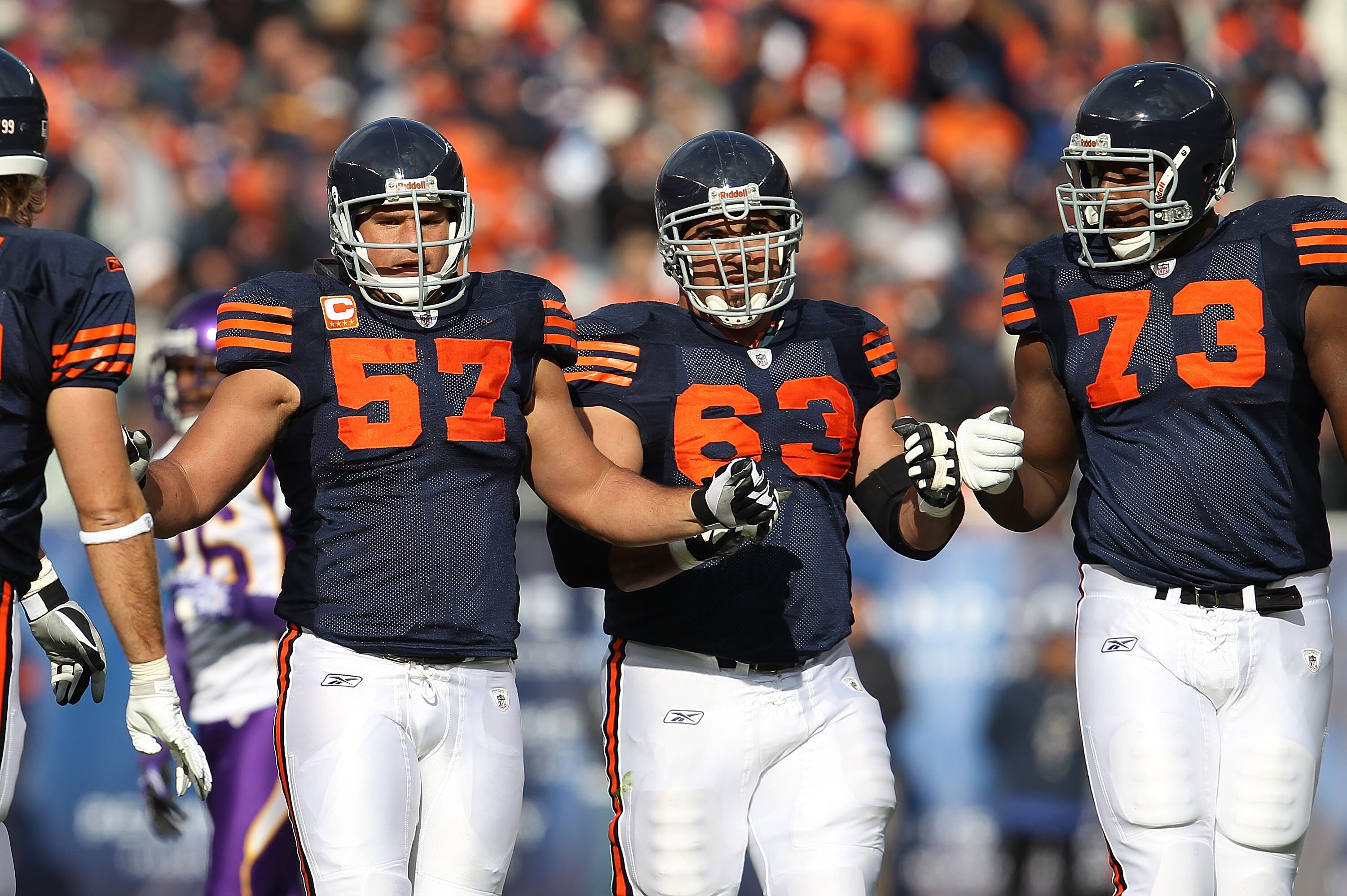 CHICAGO - NOVEMBER 14: (L-R) Olin Kreutz #57, Roberto Garza #63 and J'Marcus Webb #73 of the Chicago Bears celebrate an offensive gain against the Minnesota Vikings at Soldier Field on November 14, 2010 in Chicago, Illinois. The Bears defeated the Vikings CHICAGO - NOVEMBER 14: (L-R) Olin Kreutz #57, Roberto Garza #63 and J'Marcus Webb #73 of the Chicago Bears celebrate an offensive gain against the Minnesota Vikings at Soldier Field on November 14, 2010 in Chicago, Illinois. The Bears defeated the Vikings