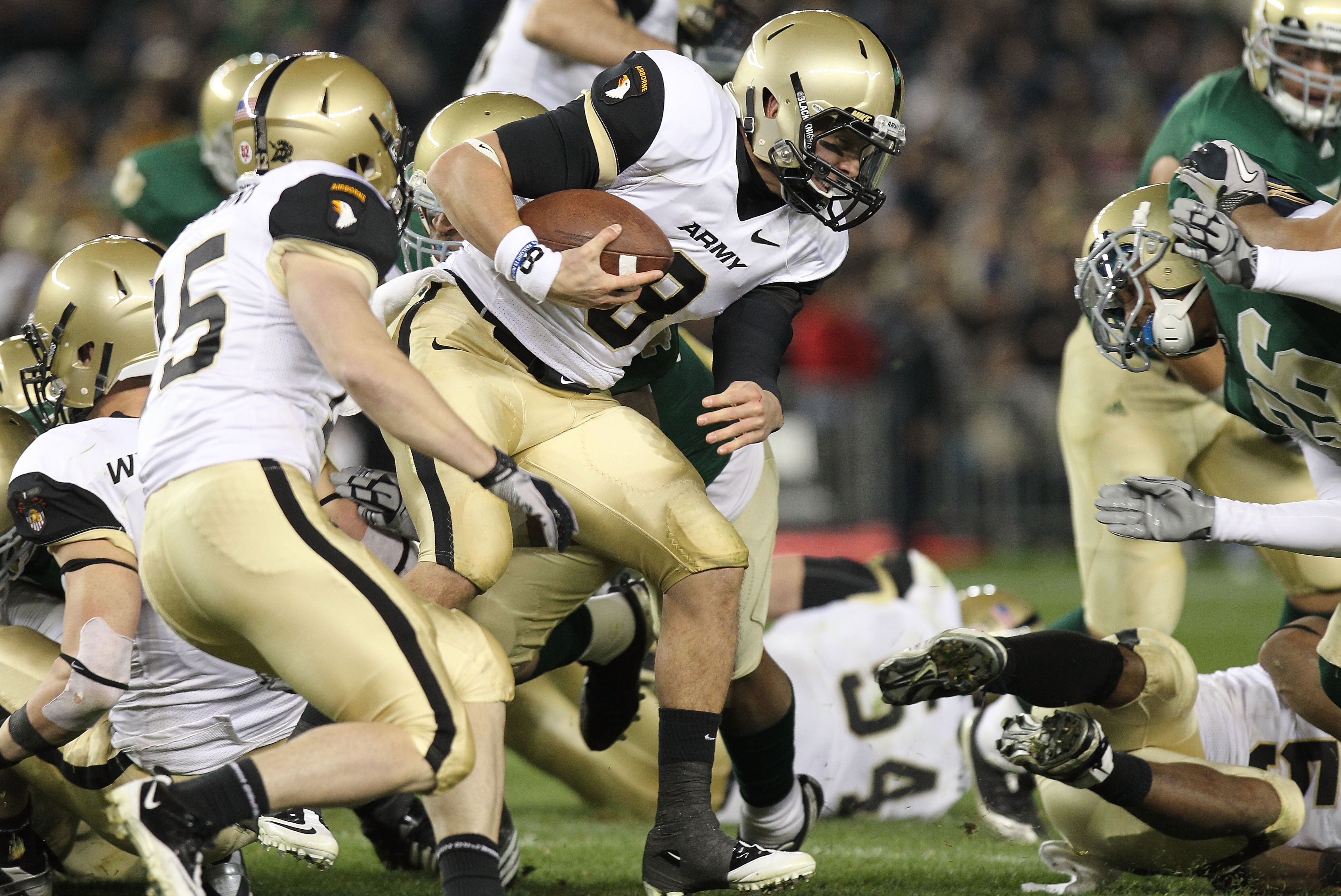 NEW YORK - NOVEMBER 20:  Trent Steelman #8 of the Army Black Knights is tackled against the Notre Dame Fighting Irish at Yankee Stadium on November 20, 2010 in the Bronx borough of New York City.  (Photo by Nick Laham/Getty Images)
