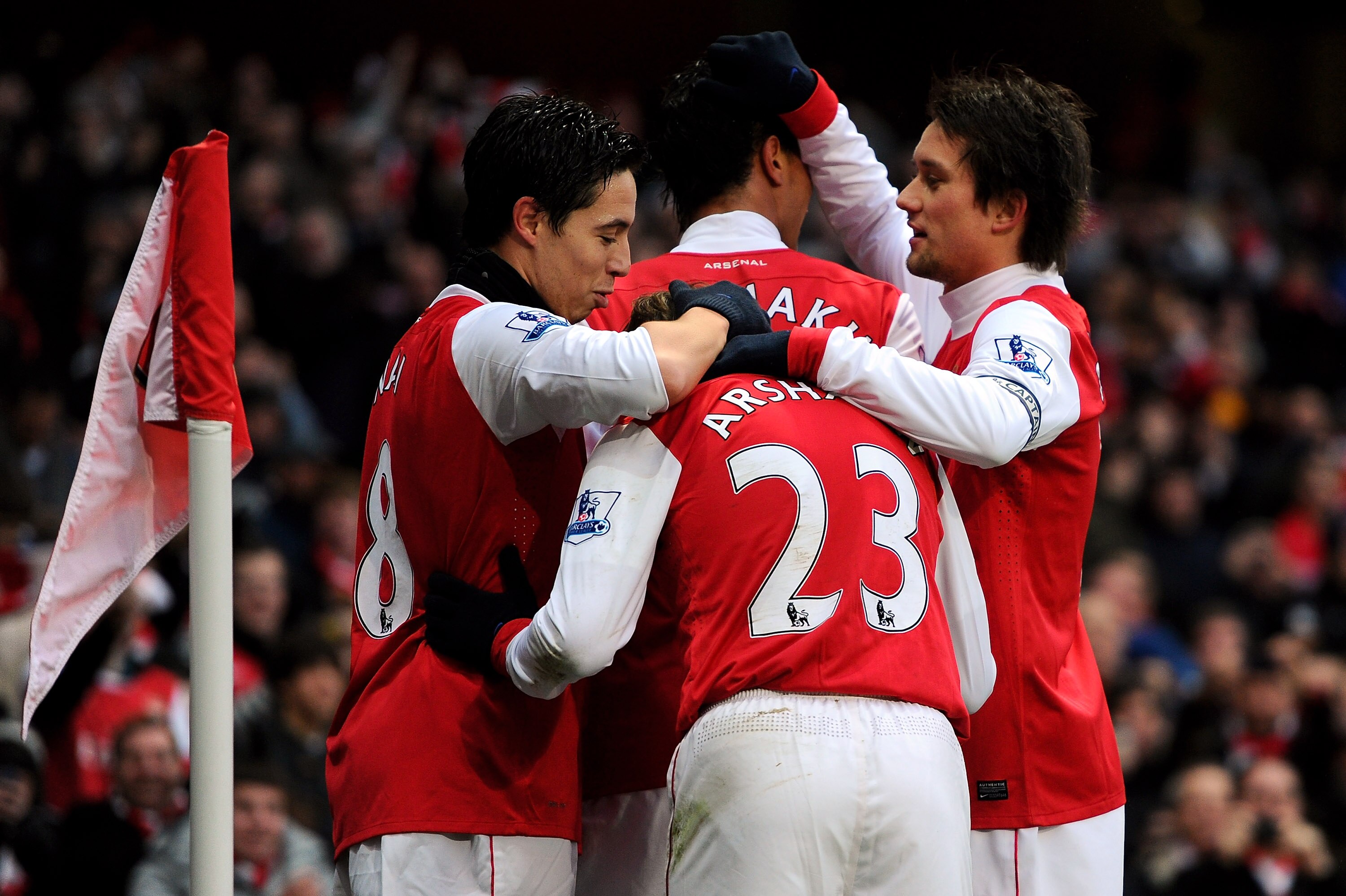 LONDON, ENGLAND - DECEMBER 04:  Samir Nasri (L) of Arsenal is congratulated by teammates after scoring the opening goal during the Barclays Premier League match between Arsenal and Fulham at the Emirates Stadium on December 4, 2010 in London, England.  (P