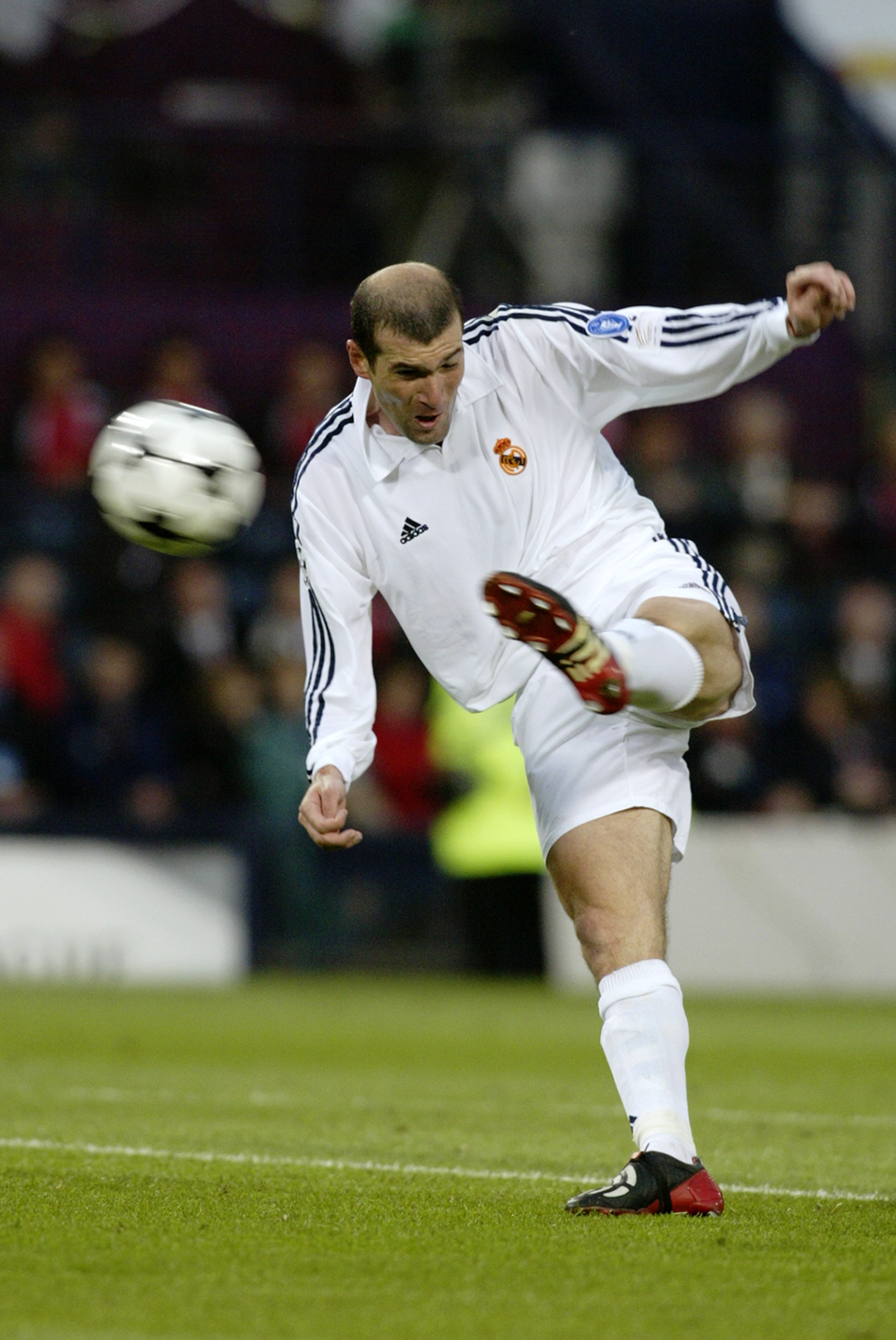 GLASGOW - May 15:  Zinedine Zidane of Real Madrid scores a wonderful goal during the UEFA Champions League Final between Real Madrid and Bayer Leverkusen played at Hampden Park, in Glasgow, Scotland on May 15, 2002. Real Madrid won the match and cup 2-1.