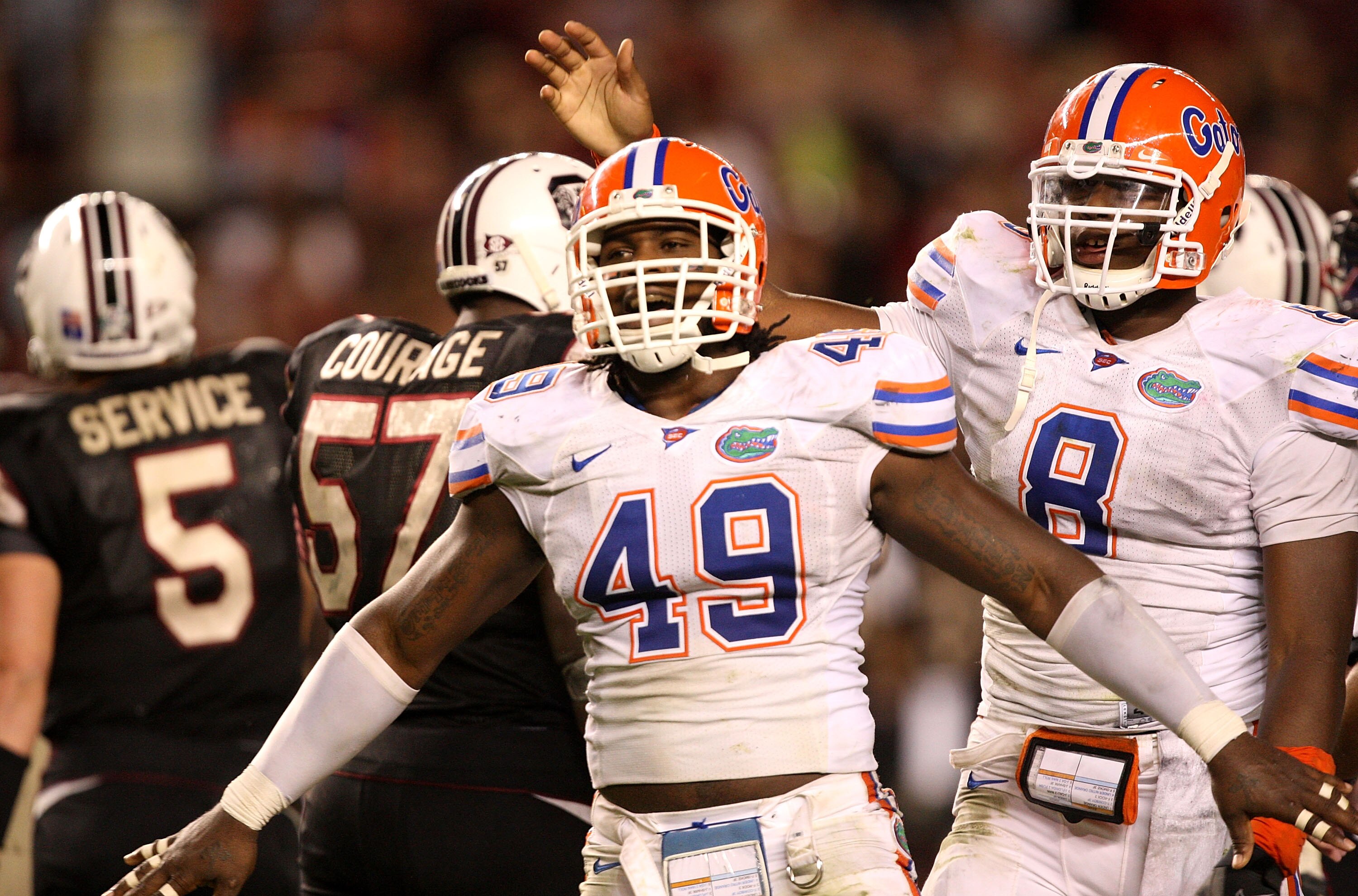 COLUMBIA, SC - NOVEMBER 14: Jermaine Cunningham #49 and teammate Carlos Dunlap #8 of the Florida Gators react after a defensive stopp against the South Carolina Gamecocks during their game at Williams-Brice Stadium on November 14, 2009 in Columbia, South COLUMBIA, SC - NOVEMBER 14: Jermaine Cunningham #49 and teammate Carlos Dunlap #8 of the Florida Gators react after a defensive stopp against the South Carolina Gamecocks during their game at Williams-Brice Stadium on November 14, 2009 in Columbia, South