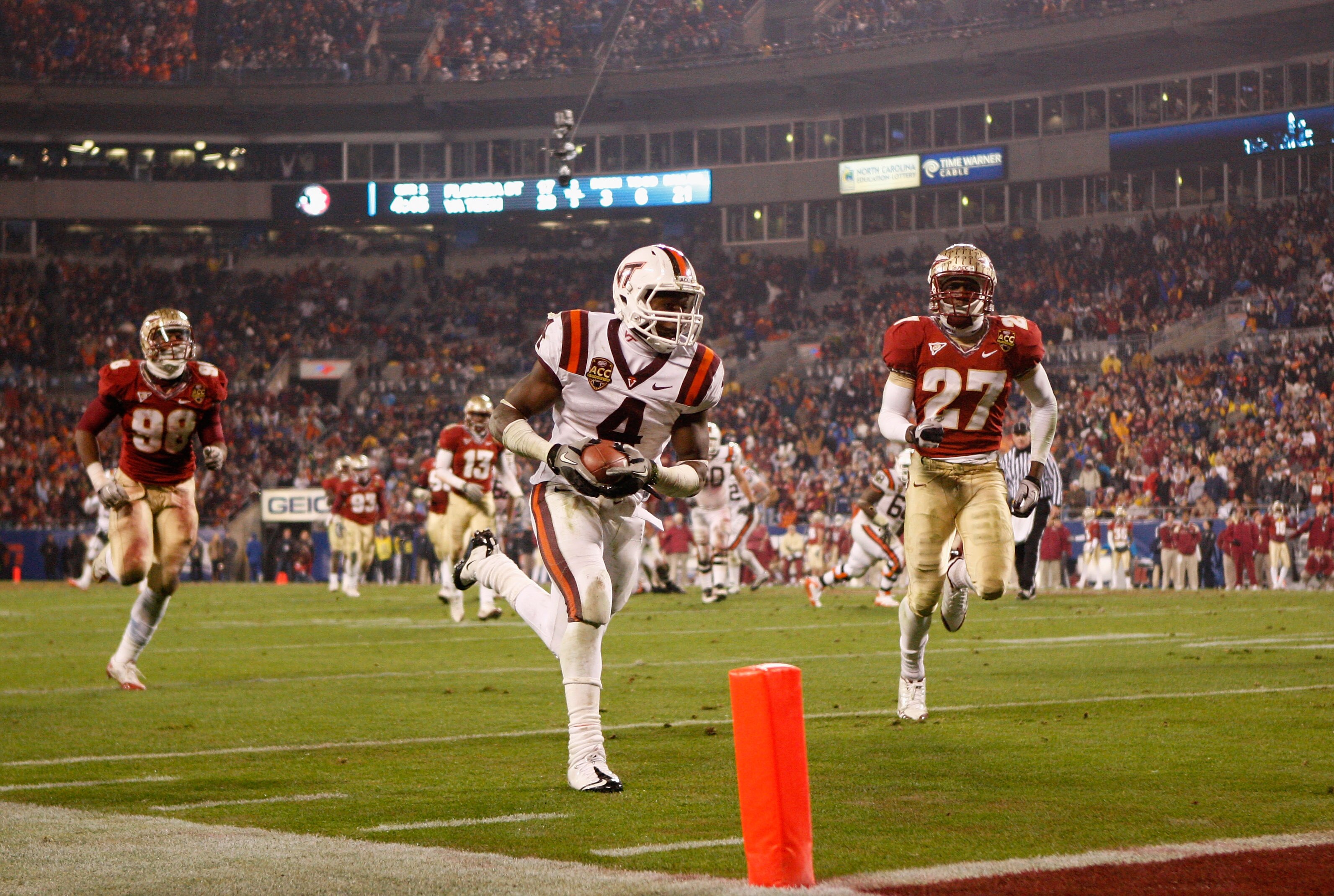 CHARLOTTE, NC - DECEMBER 04:  David Wilson #4 of the Virginia Tech Hokies runs for a touchdown during their game against the Florida State Seminoles at Bank of America Stadium on December 4, 2010 in Charlotte, North Carolina.  (Photo by Streeter Lecka/Get