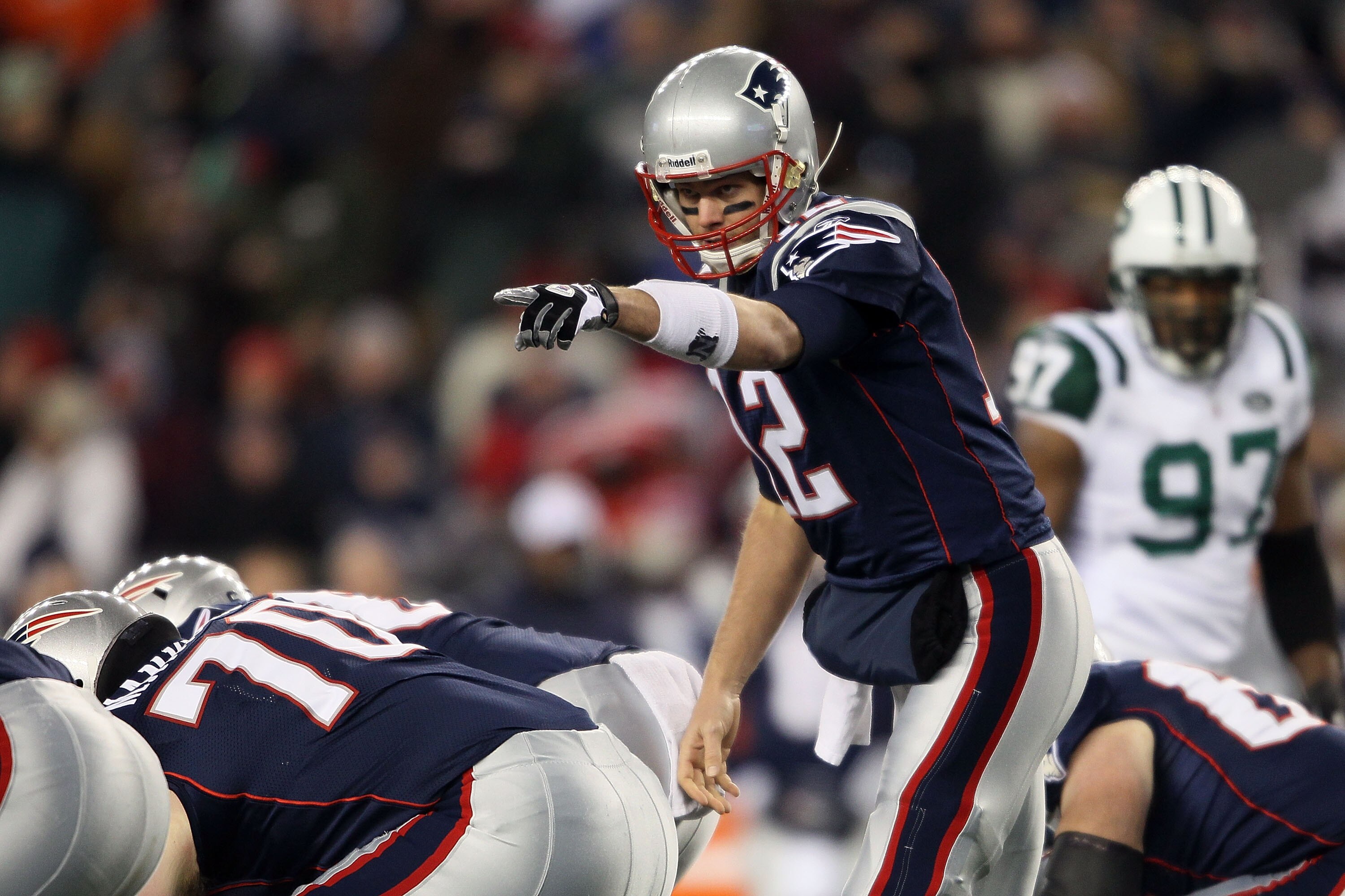 FOXBORO, MA - DECEMBER 06:  Tom Brady #12 of the New England Patriots gestures at the line of scrimmage against the New York Jets at Gillette Stadium on December 6, 2010 in Foxboro, Massachusetts.  (Photo by Elsa/Getty Images)