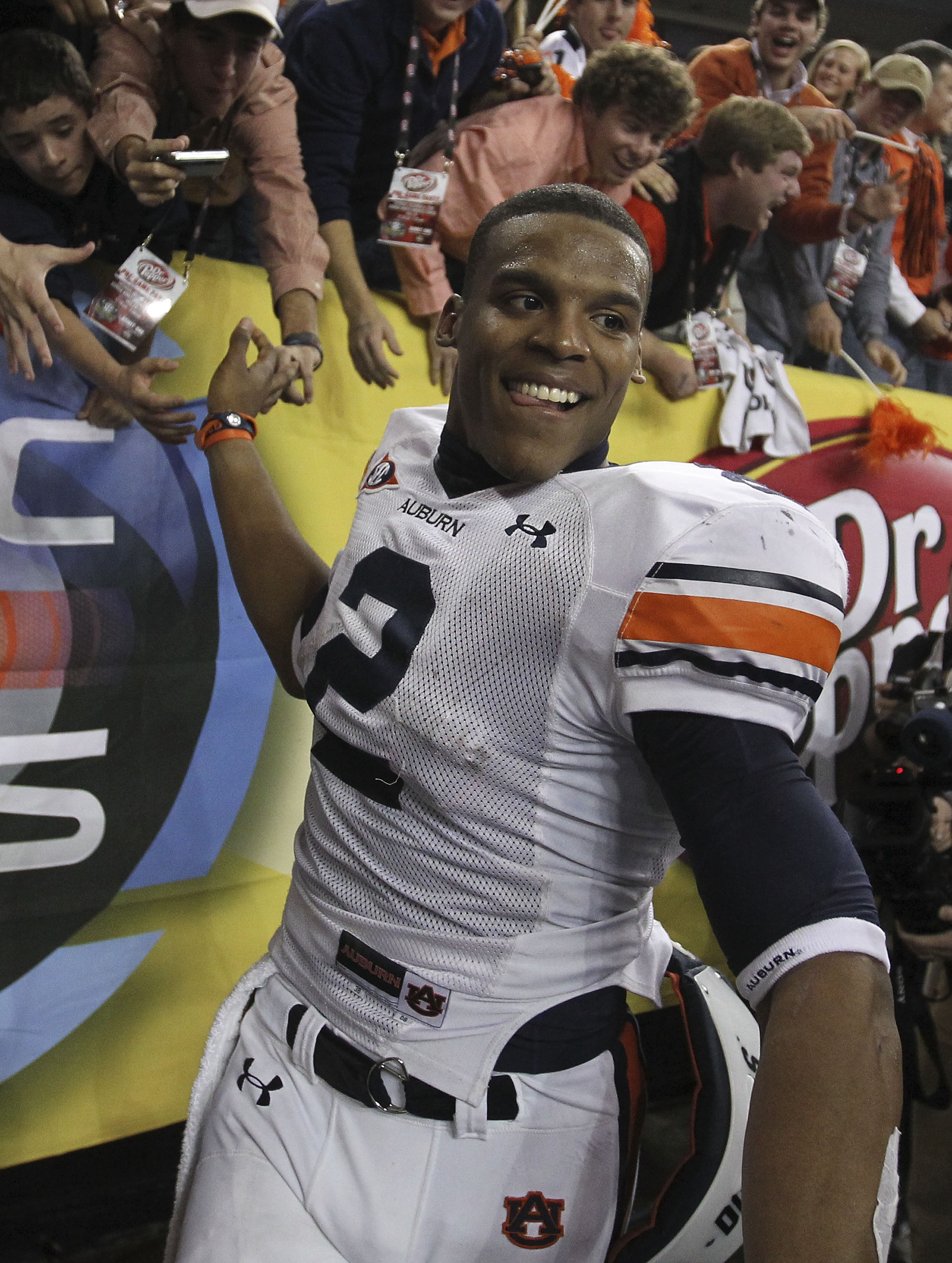 ATLANTA - DECEMBER 04:  Quarterback Cam Newton #2 of the Auburn Tigers celebrates with the crowd after the 2010 SEC Championship against the South Carolina Gamecocks at Georgia Dome on December 4, 2010 in Atlanta, Georgia.  The Tigers beat the Gamecocks 5