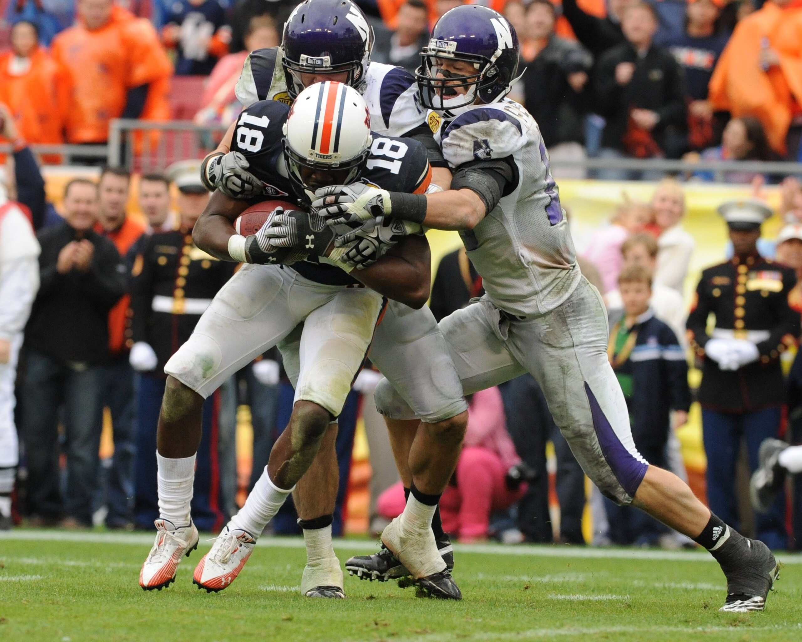 TAMPA, FL - JANUARY 1: Wide receiver Kodi Burns #18 of the Auburn Tigers returns a kick against the Northwestern Wildcats in the Outback Bowl January 1, 2010 at Raymond James Stadium in Tampa, Florida.  (Photo by Al Messerschmidt/Getty Images)