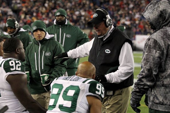FOXBORO, MA - DECEMBER 06:  Head coach Rex Ryan of the New York Jets talks to his players on the bench during the first quarter against the New England Patriots at Gillette Stadium on December 6, 2010 in Foxboro, Massachusetts.  (Photo by Chris Chambers/G
