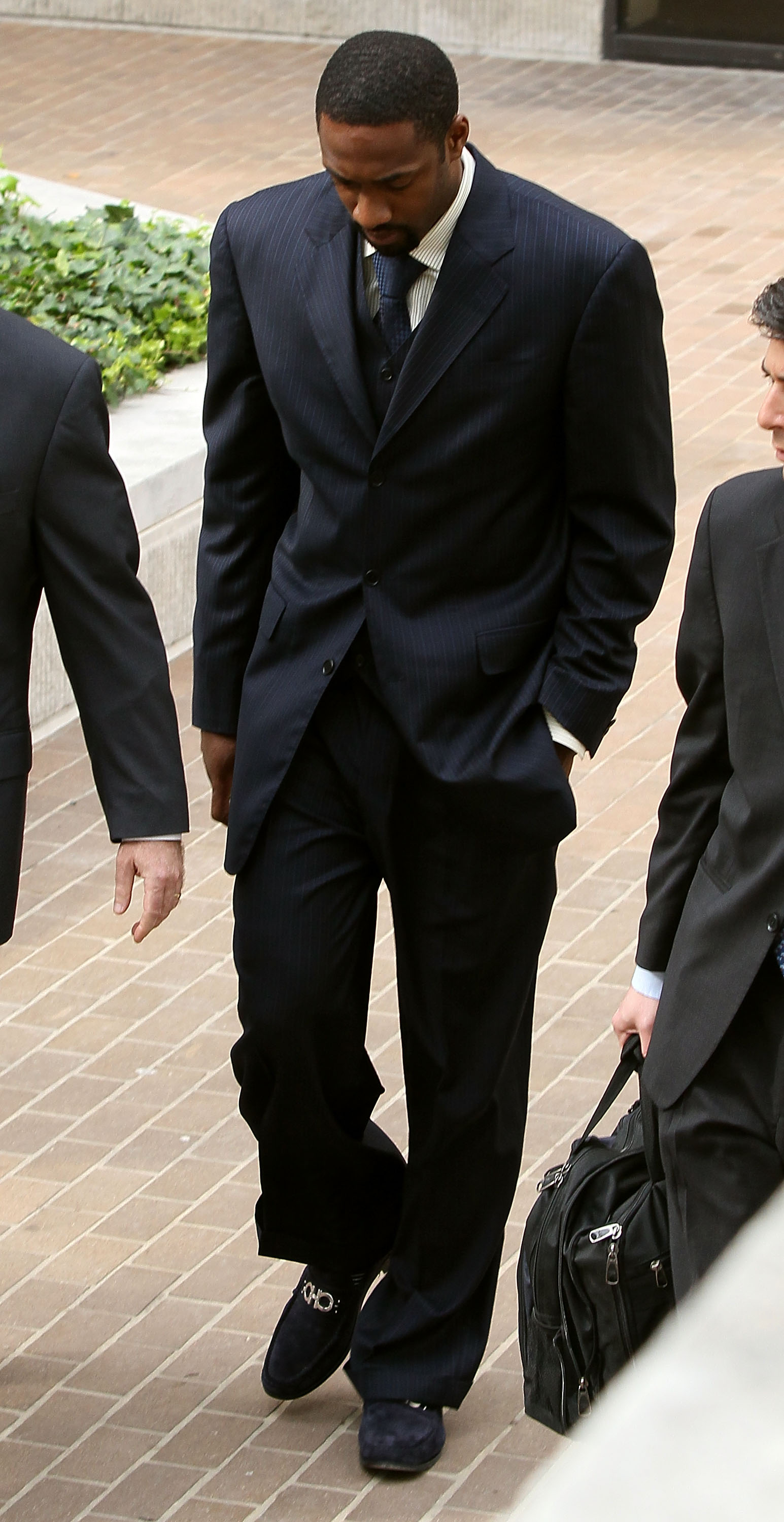 WASHINGTON - MARCH 26:  NBA player Gilbert Arenas of the Washington Wizards leaves the District of Columbia Court after being sentenced March 26, 2010 in Washington, DC. The Washington Wizards star recieved two years probation for bringing guns into the W
