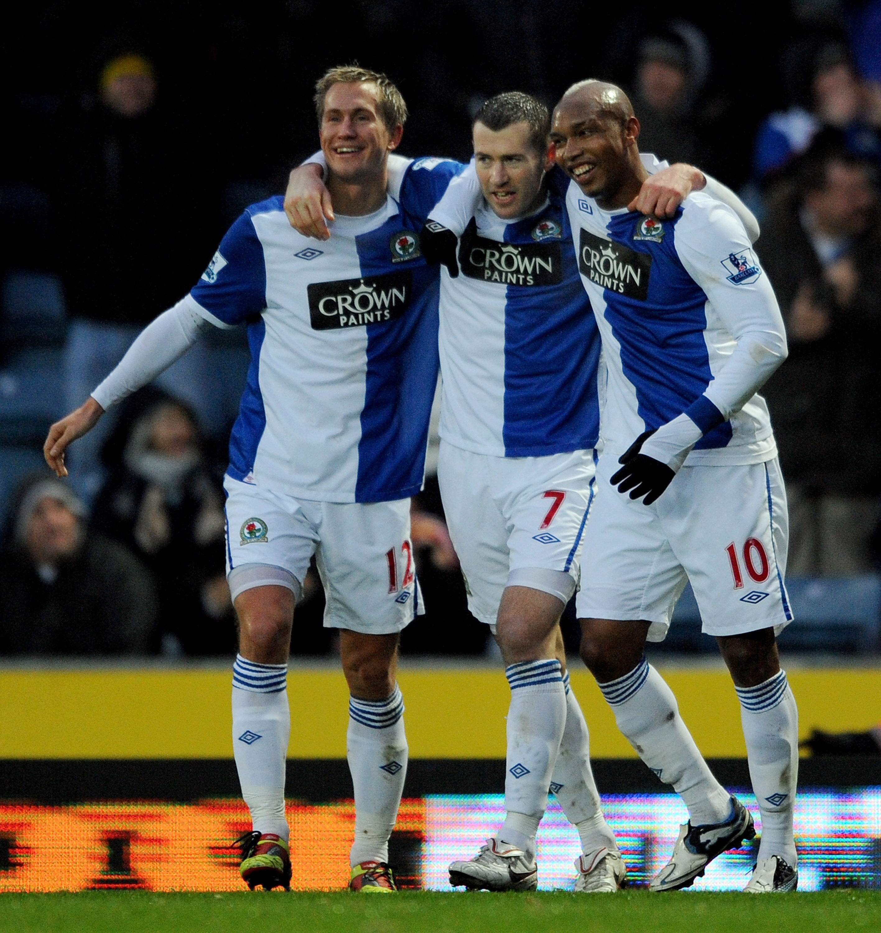 BLACKBURN, ENGLAND - DECEMBER 04:  Brett Emerton of Blackburn Rovers is congratulated by team-mates Morten Gamst-Pedersen and El Hadji Diouf after scoring his side's second goal during the Barclays Premier League match between Blackburn Rovers and Wolverh
