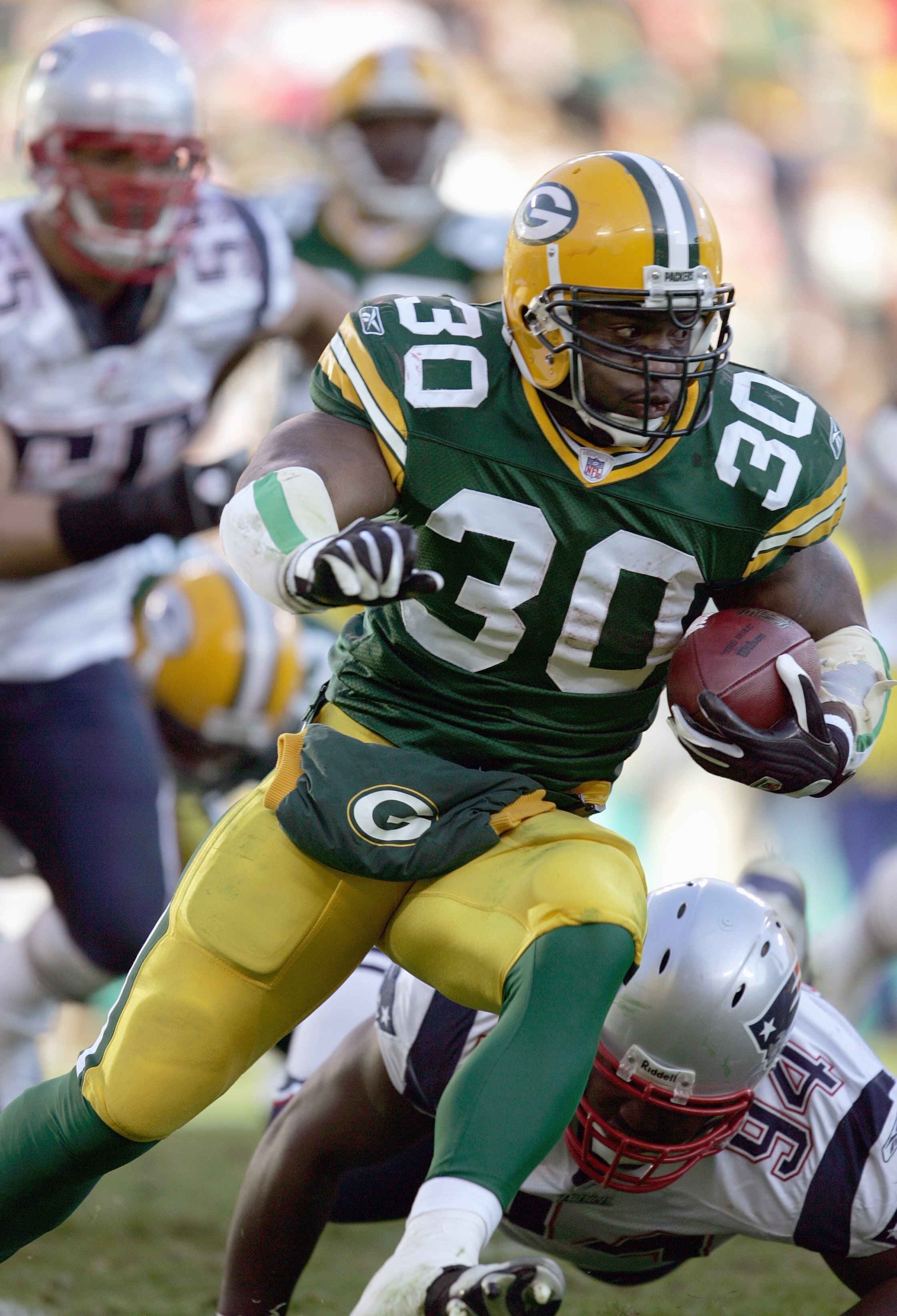 GREEN BAY, WI - NOVEMBER 19: Ahman Green #30 of the Green Bay Packers carries the ball during the game against the New England Patriots on November 19, 2006 at Lambeau Field in Green Bay, Wisconsin. The Patriots defeated the Packers 35-0. (Photo by Jonath