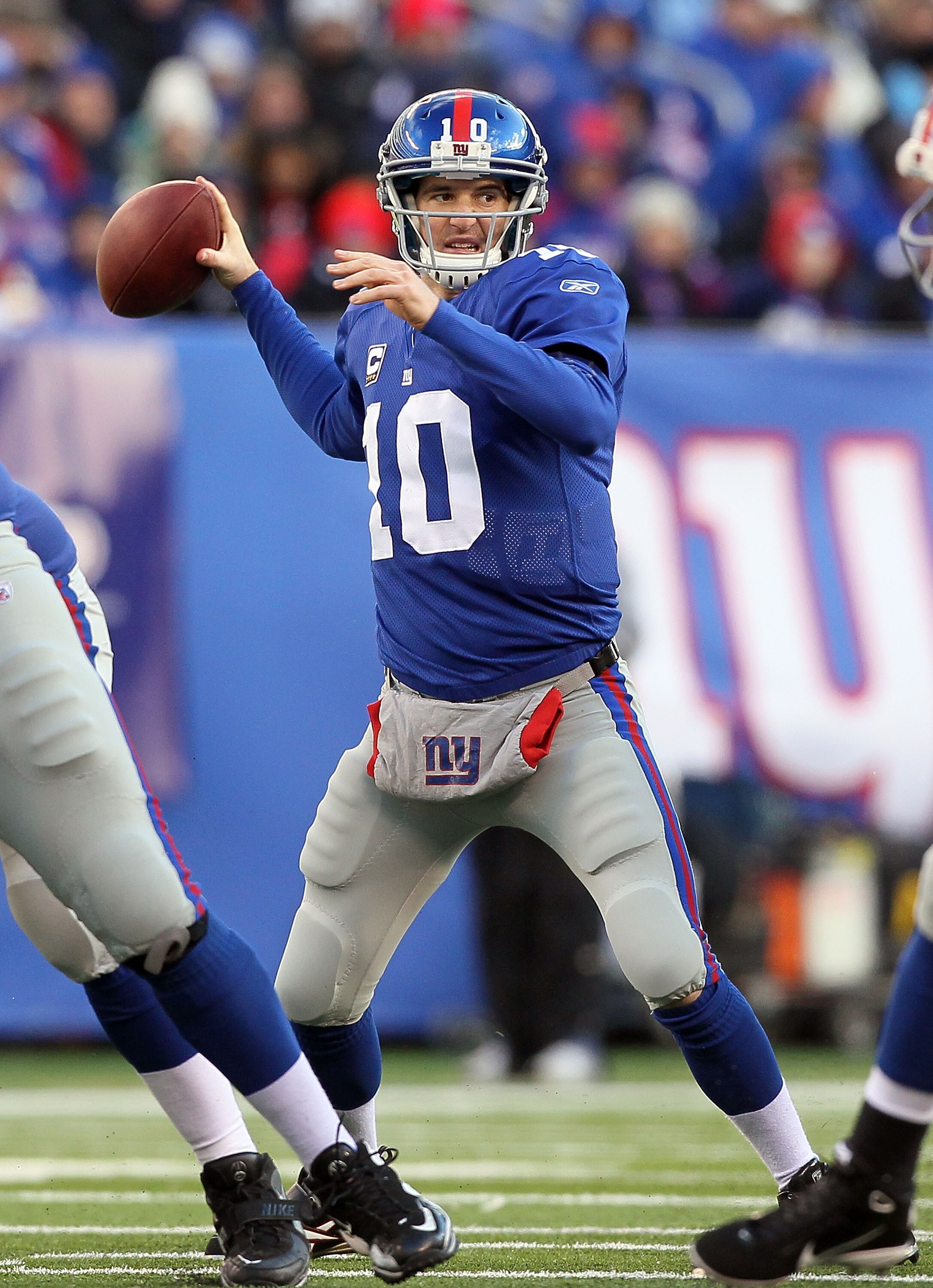 EAST RUTHERFORD, NJ - DECEMBER 05:  Eli Manning #10 of the New York Giants throws a pass against the Washington Redskins on December 5, 2010 at the New Meadowlands Stadium in East Rutherford, New Jersey.  (Photo by Jim McIsaac/Getty Images)