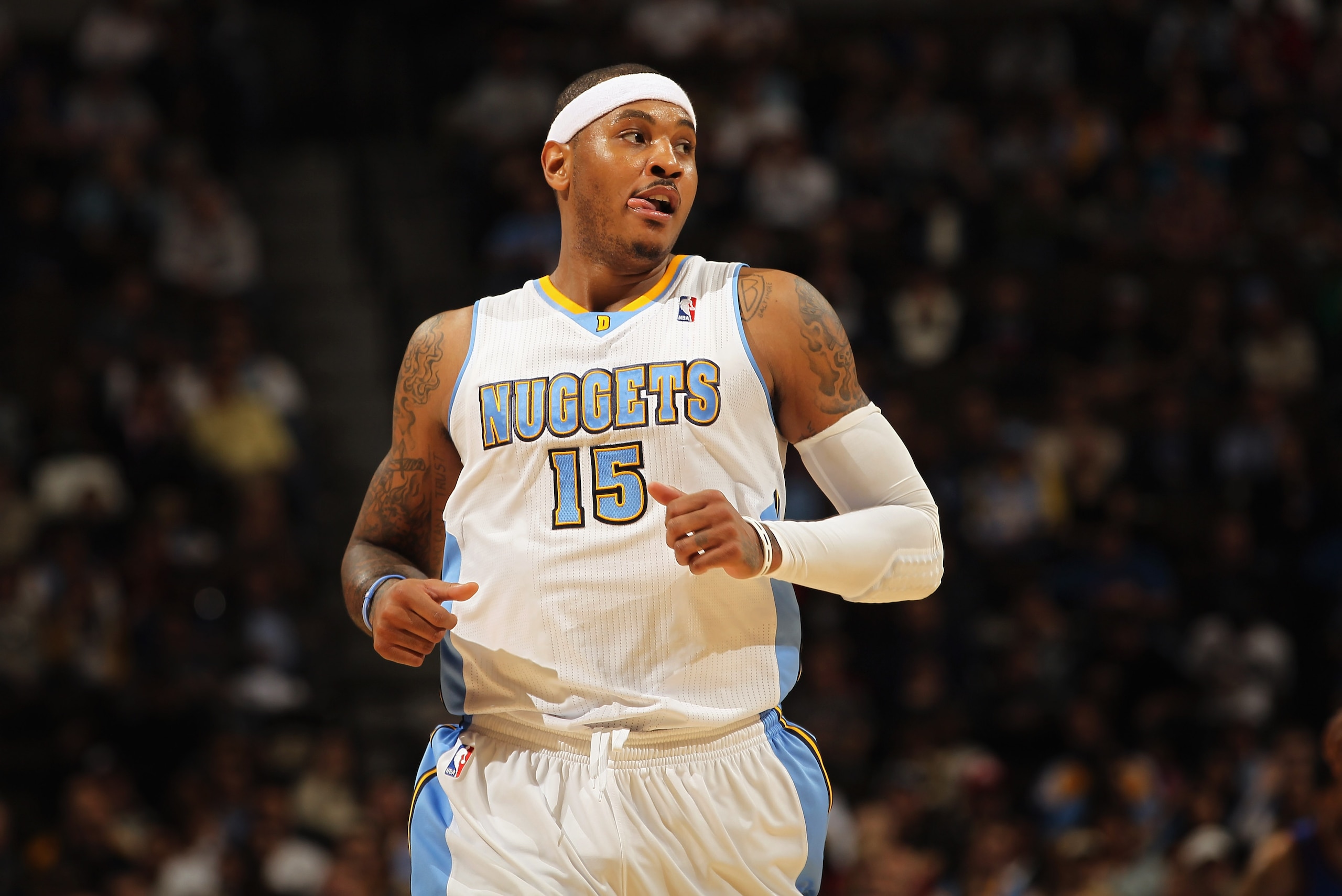 DENVER - NOVEMBER 16: Carmelo Anthony #15 of the Denver Nuggets looks on during a break in the action against the New York Knicks at the Pepsi Center on November 16, 2010 in Denver, Colorado. The Nuggets defeated the Knicks 120-118. NOTE TO USER: User ex DENVER - NOVEMBER 16: Carmelo Anthony #15 of the Denver Nuggets looks on during a break in the action against the New York Knicks at the Pepsi Center on November 16, 2010 in Denver, Colorado. The Nuggets defeated the Knicks 120-118. NOTE TO USER: User ex