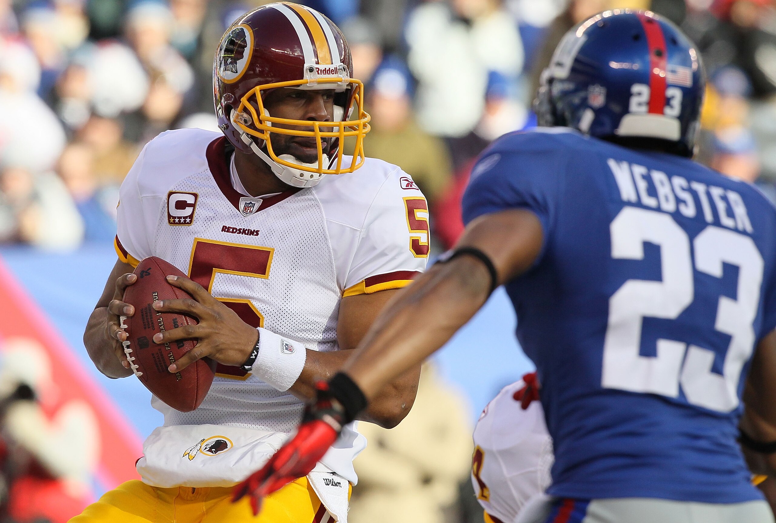 EAST RUTHERFORD, NJ - DECEMBER 05:  Donovan McNabb #5 of the Washington Redskins looks to throw a pass against the New York Giants on December 5, 2010 at the New Meadowlands Stadium in East Rutherford, New Jersey. The Giants defeated the Redskins 31-7.  (