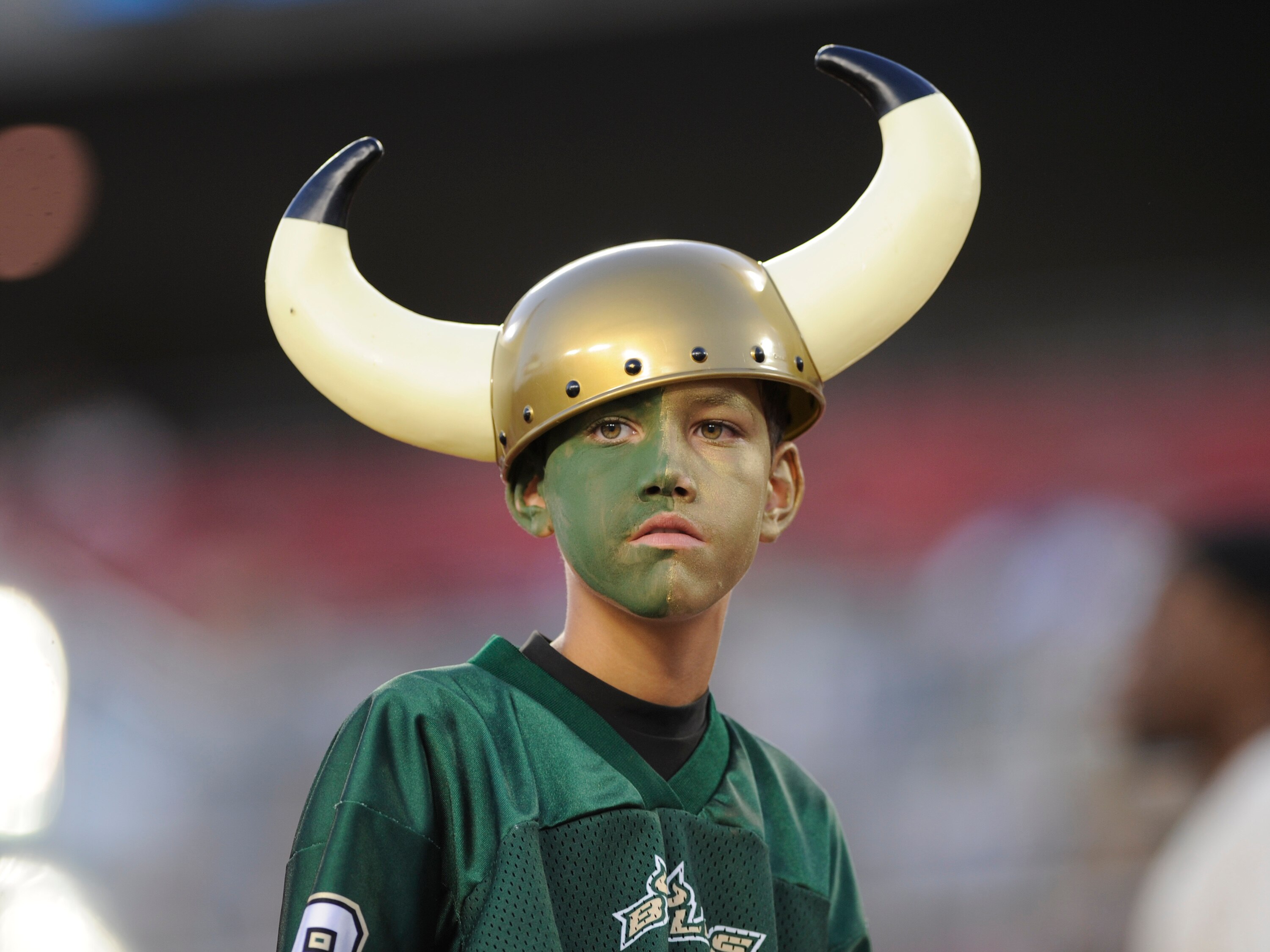 TAMPA, FL - OCTOBER 2: A young fan of the University of South Florida Bulls watches play against the Pittsburgh Panthers at Raymond James Stadium on October 2, 2008 in Tampa, Florida.  (Photo by Al Messerschmidt/Getty Images)
