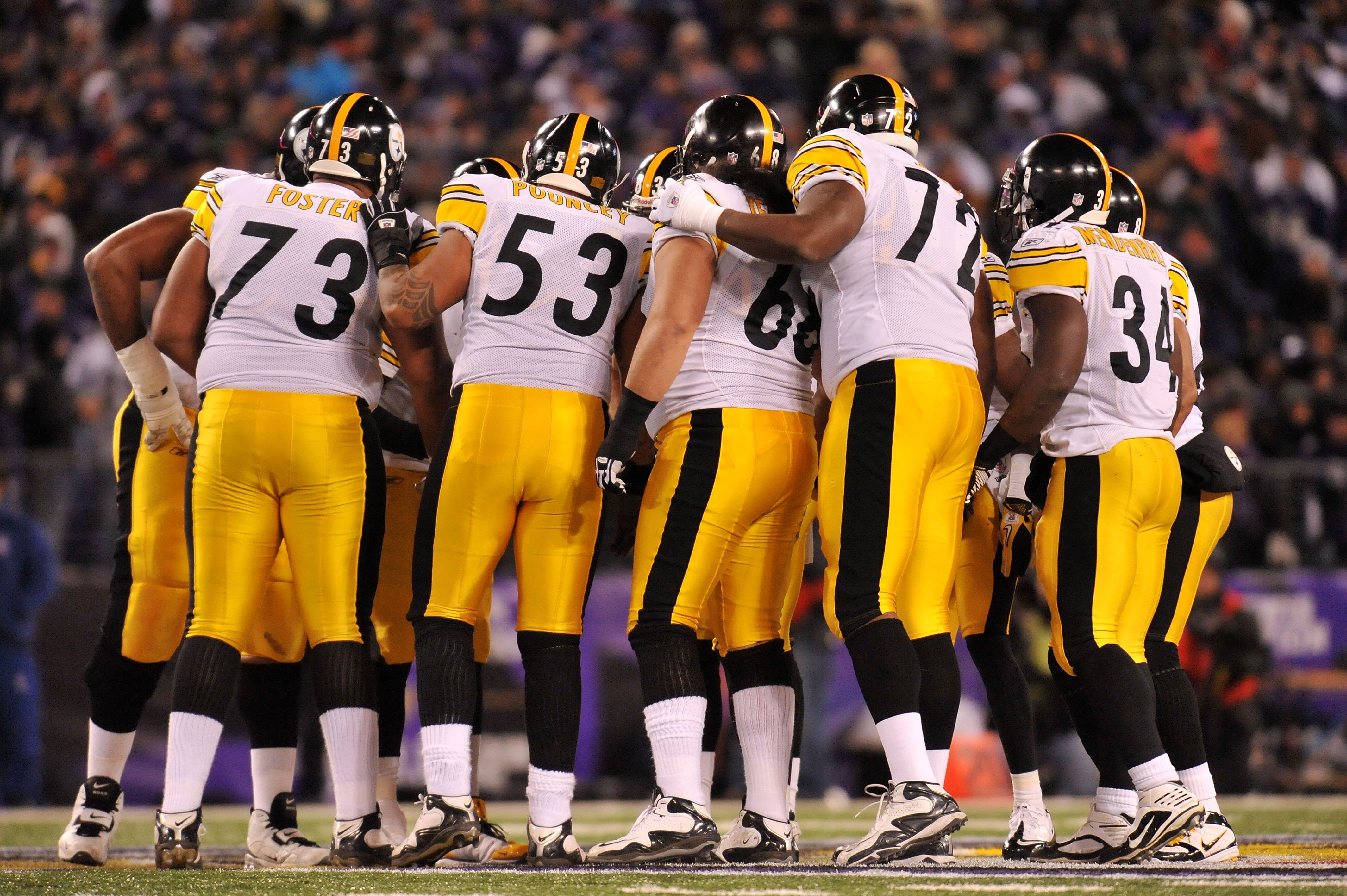 BALTIMORE, MD - DECEMBER 05:  Members of the Pittsburgh Steelers huddle together while playing against the Baltimore Ravens at M&T Bank Stadium on December 5, 2010 in Baltimore, Maryland.  (Photo by Larry French/Getty Images)