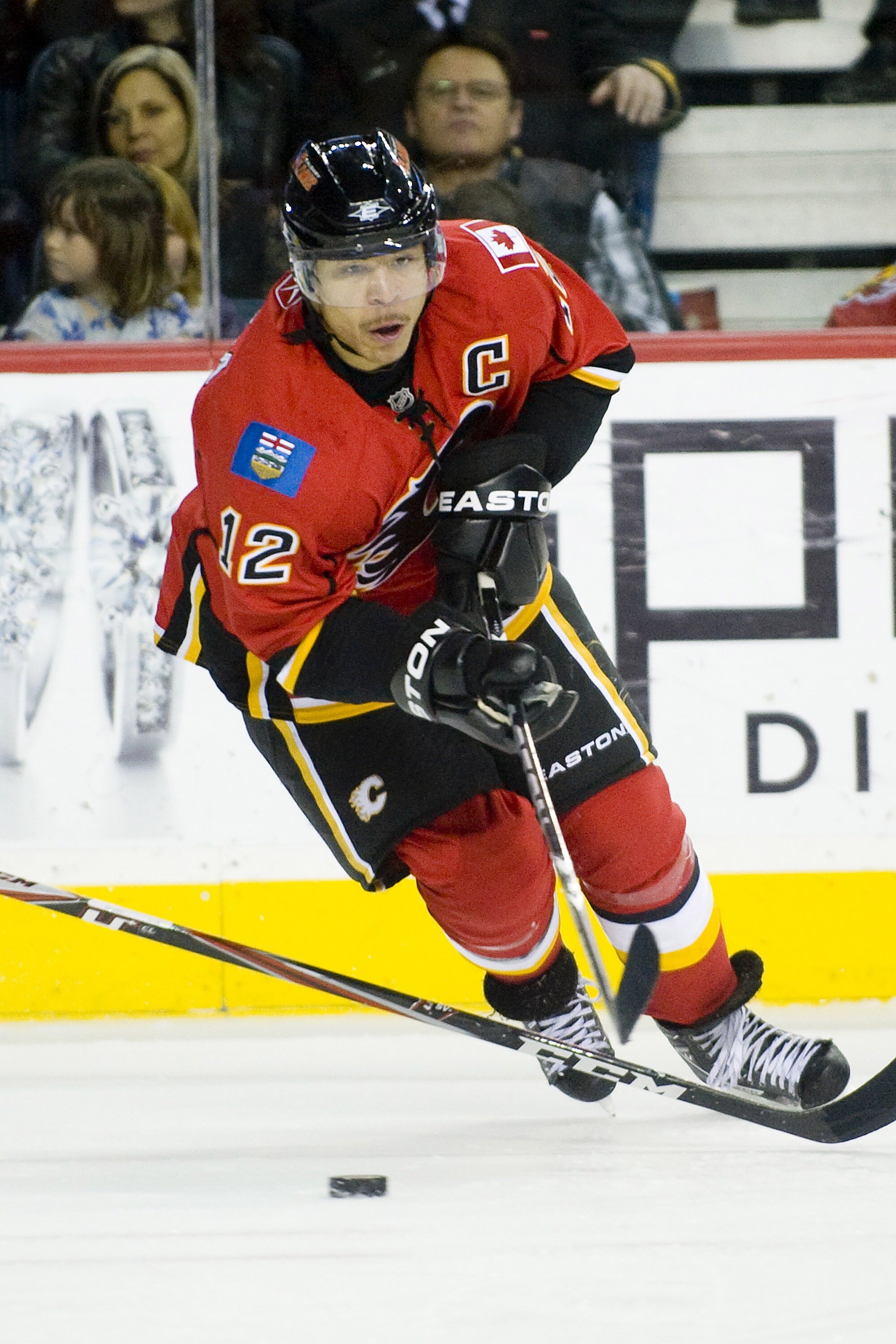 EDMONTON, AB - NOVEMBER 29:  Jarome Iginla #12 of the Calgary Flames carries the puck against the Minnesota Wild at Scotiabank Saddledome on November 29, 2010 in Calgary, Alberta, Canada. The Flames beat the Wild 3-0.  (Photo by Dylan Lynch/Getty Images)