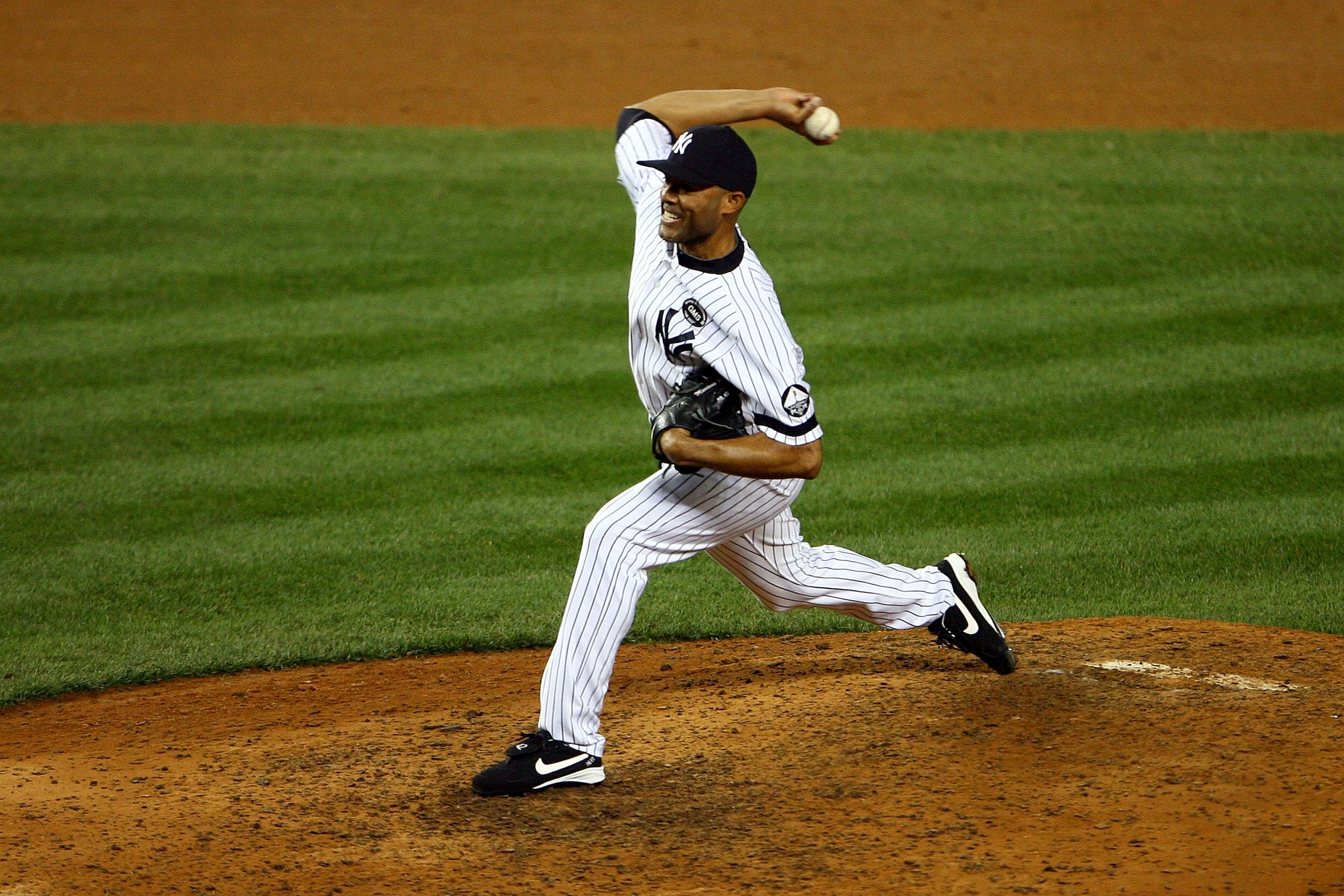 NEW YORK - OCTOBER 20:  Mariano Rivera #42 of the New York Yankees pitches against the Texas Rangers in Game Five of the ALCS during the 2010 MLB Playoffs at Yankee Stadium on October 20, 2010 in the Bronx borough of New York City.  (Photo by Andrew Burto
