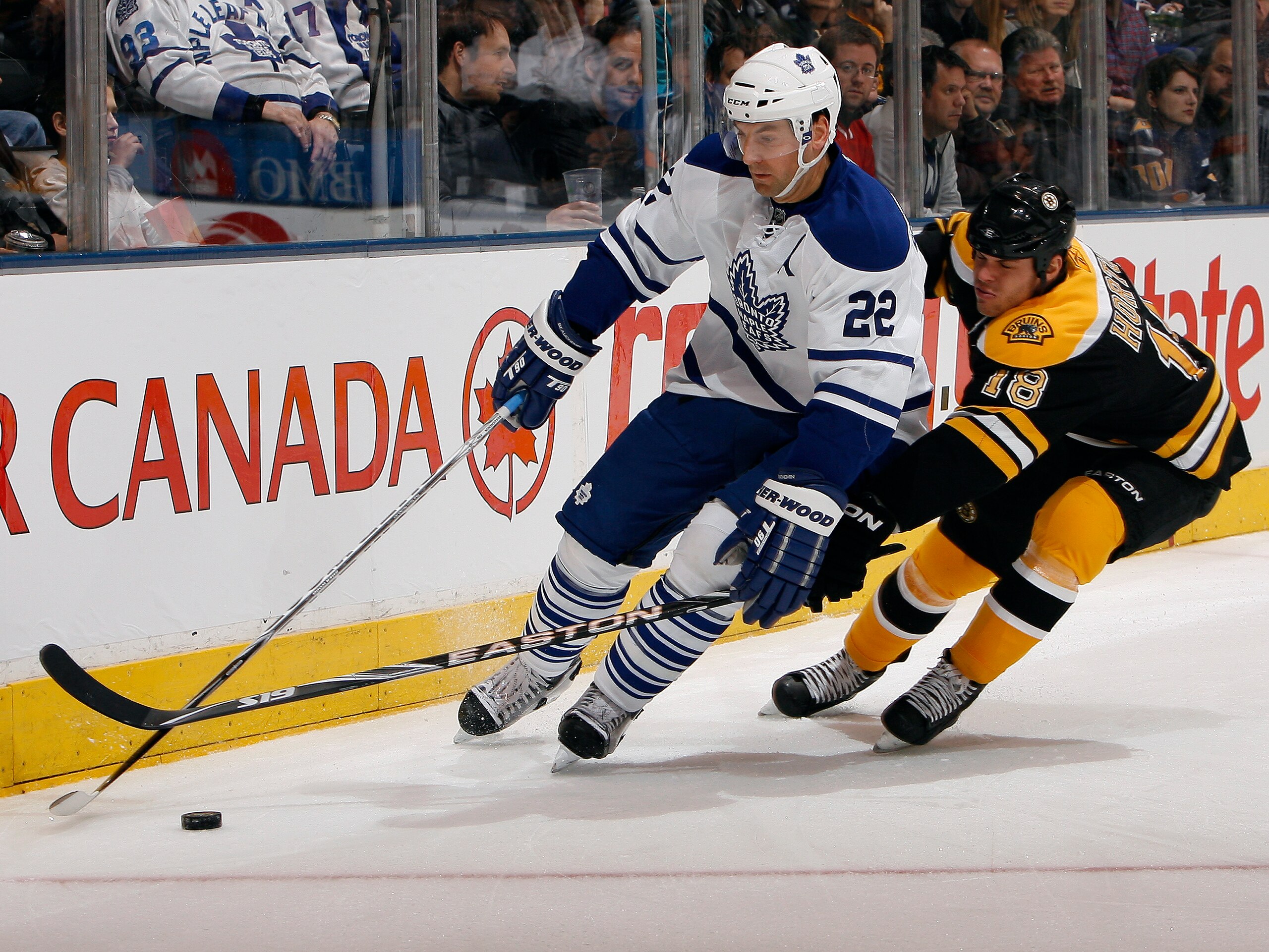 TORONTO, CANADA - DECEMBER 4: Francois Beauchemin #22 of the Toronto Maple Leafs battles for the puck with Nathan Horton #18 of the Boston Bruins during game action at the Air Canada Centre December 4, 2010 in Toronto, Ontario, Canada. (Photo by Abelimage TORONTO, CANADA - DECEMBER 4: Francois Beauchemin #22 of the Toronto Maple Leafs battles for the puck with Nathan Horton #18 of the Boston Bruins during game action at the Air Canada Centre December 4, 2010 in Toronto, Ontario, Canada. (Photo by Abelimage