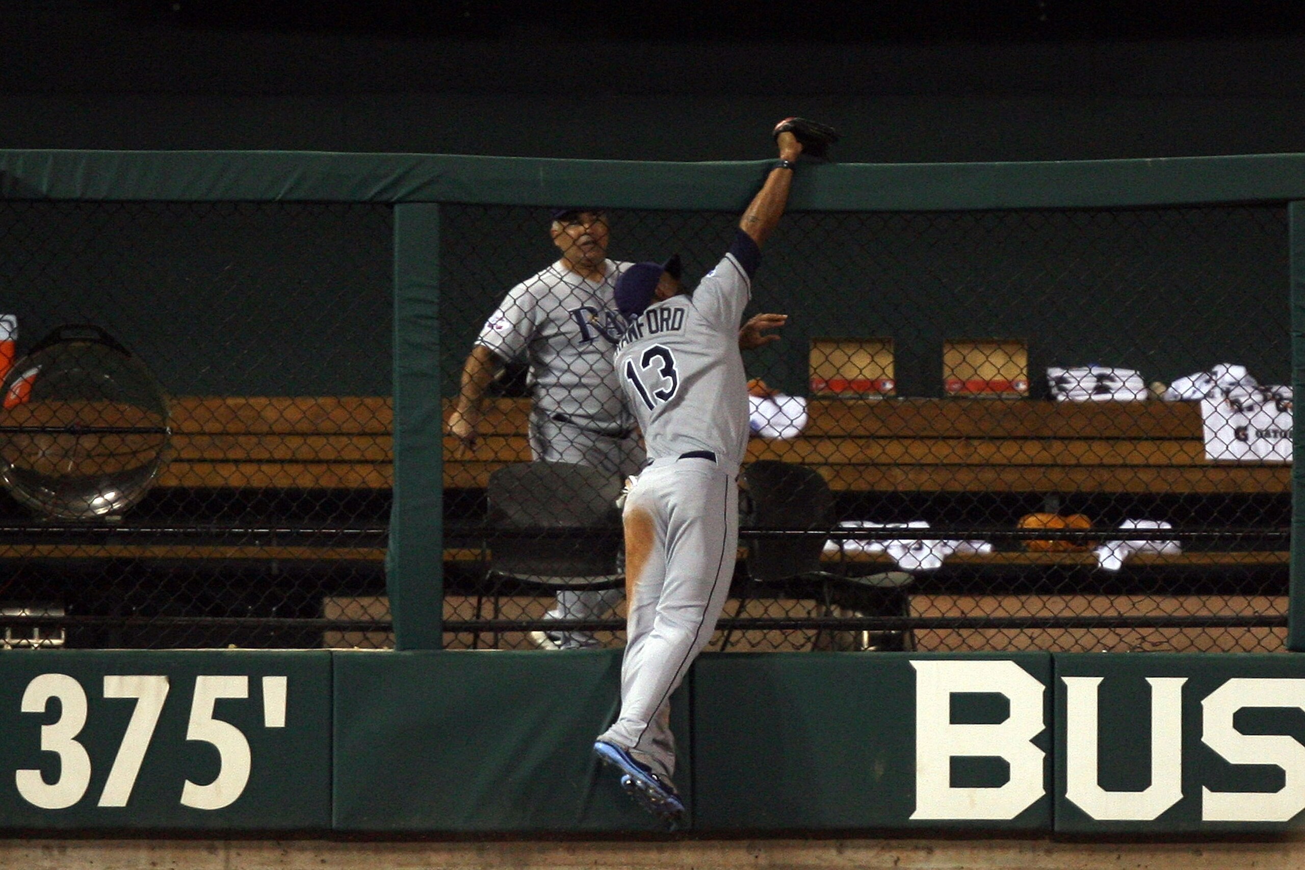 ST LOUIS, MO - JULY 14:  American League All-Star Carl Crawford of the Tampa Bay Rays robs a home run from National League All-Star Brad Hawpe of the Colorado Rockies during the 2009 MLB All-Star Game at Busch Stadium on July 14, 2009 in St Louis, Missour
