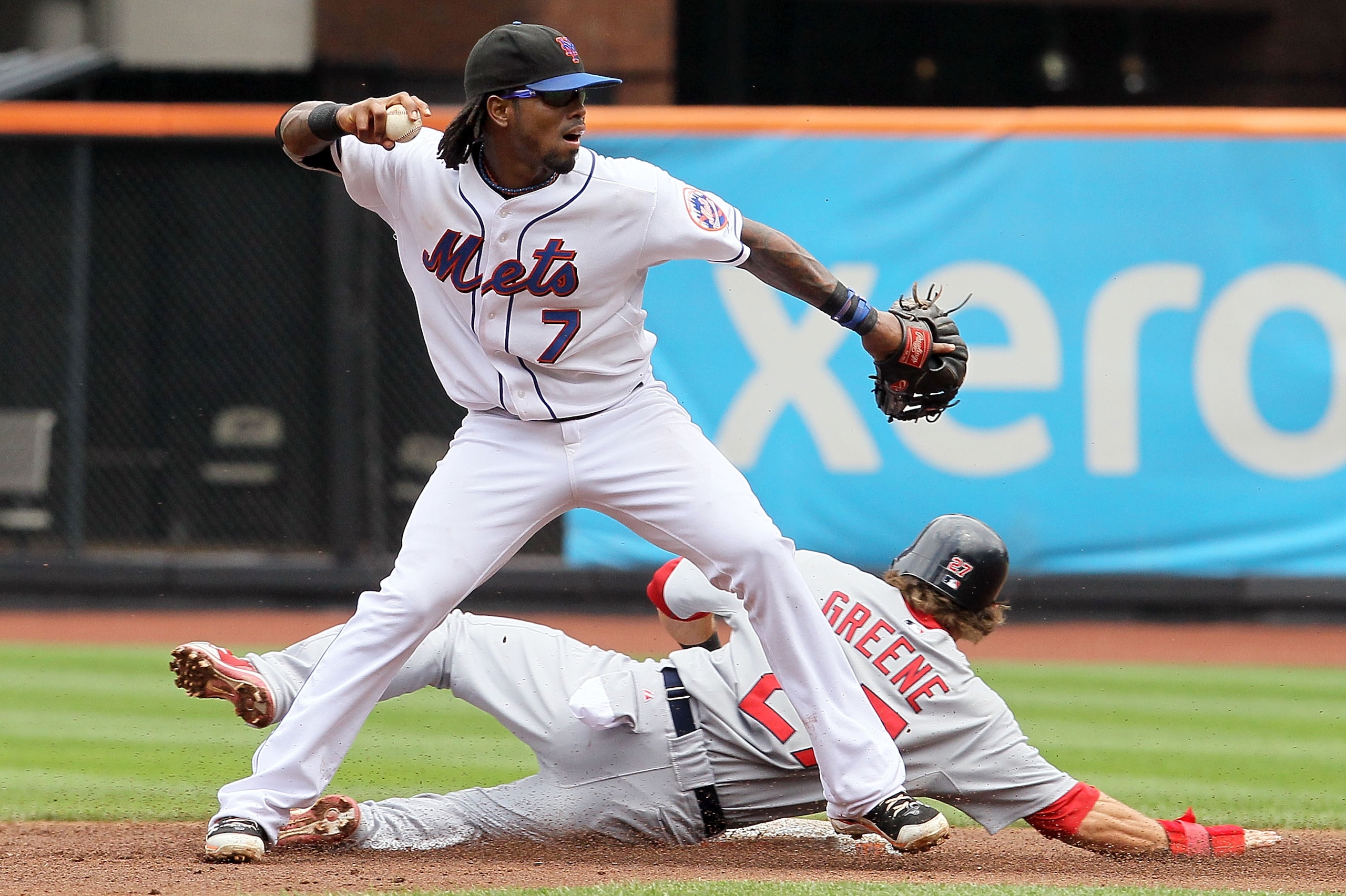 NEW YORK - JULY 29:  Jose Reyes #7 of the New York Mets throws to first base to complete a third inning ending double play after forcing out Tyler Greene #27 of the St. Louis Cardinals on July 29, 2010 at Citi Field in the Flushing neighborhood of the Que