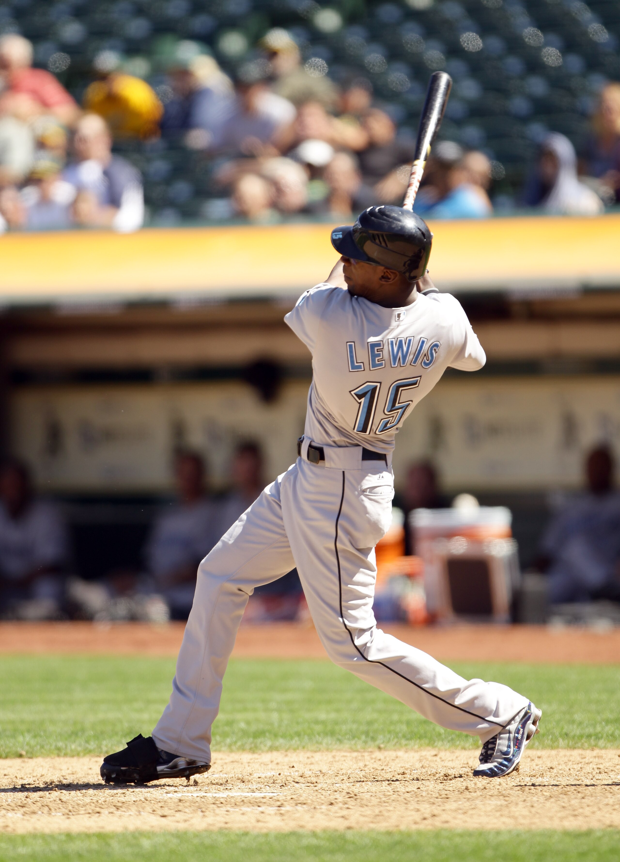 OAKLAND, CA - AUGUST 18:   Fred Lewis #15 of the Toronto Blue Jays hits a single to score  Lyle Overbay #35 and Dewayne Wise #1 to tie the game 4-4 against the Oakland Athletics in the ninth inning at the Oakland-Alameda County Coliseum on August 18, 2010
