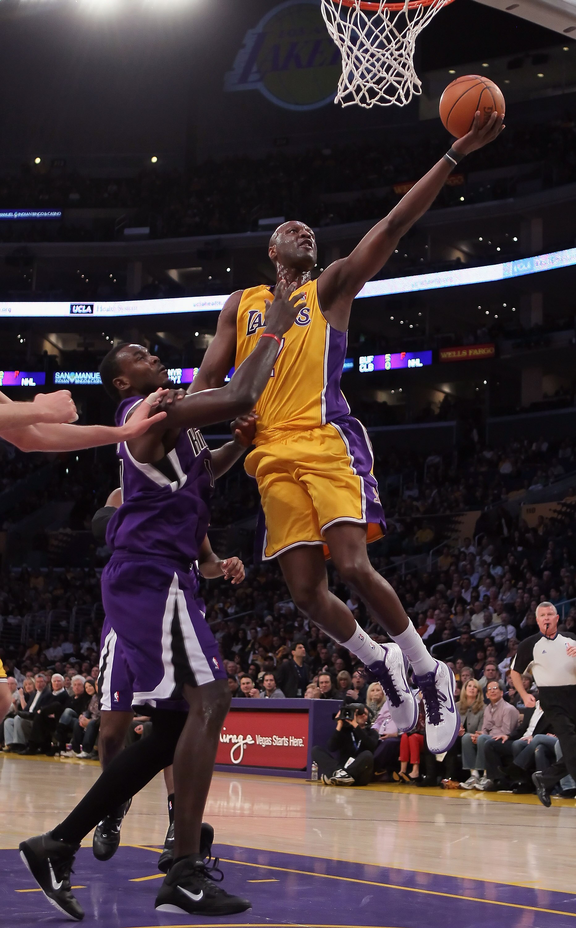 LOS ANGELES, CA - DECEMBER 03:  Lamar Odom #7 of the Los Angeles Lakers drives to the basket while being defended by Samuel Dalembert #10 of the Sacramento Kings during the first half at Staples Center on December 3, 2010 in Los Angeles, California. The L