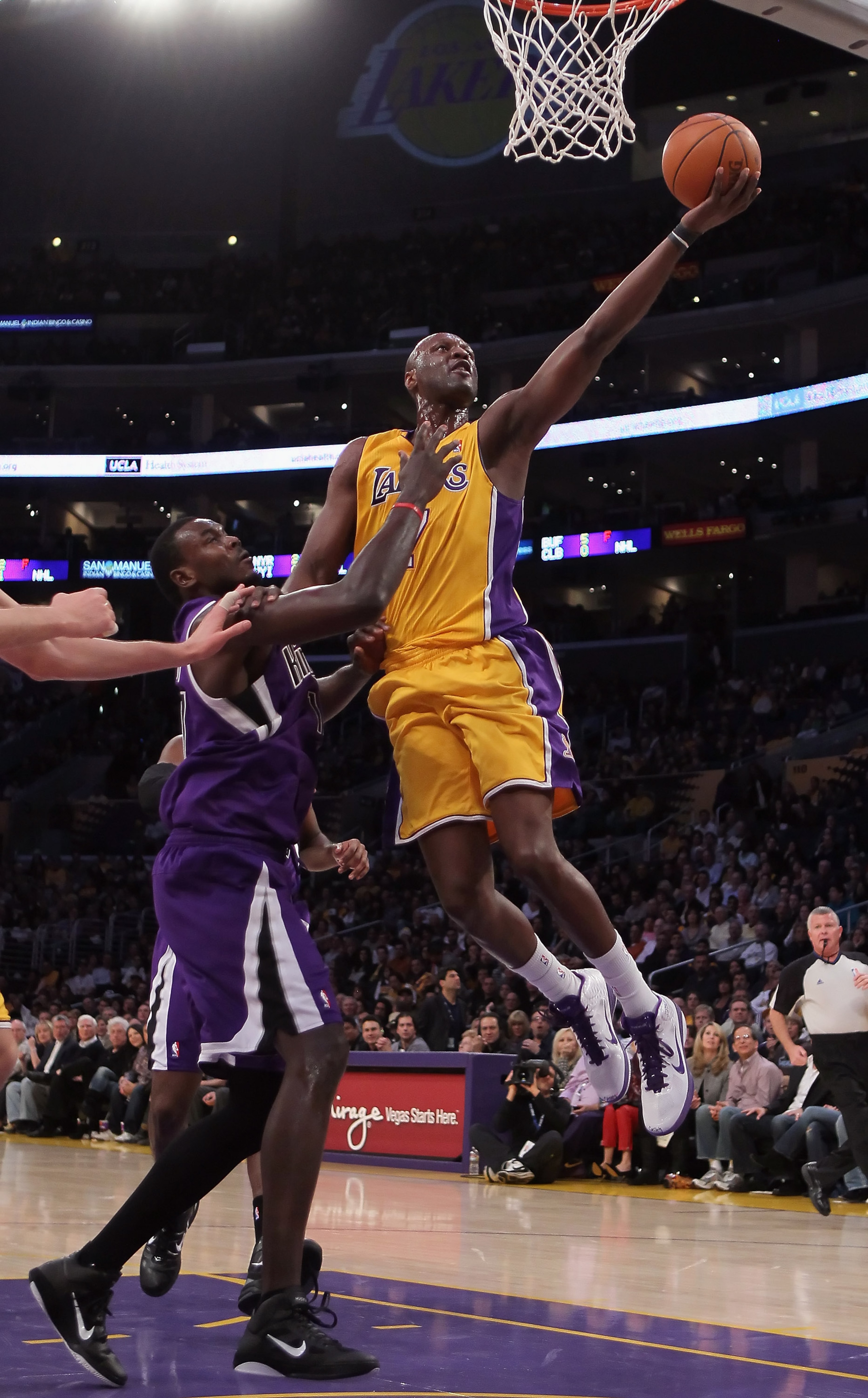 LOS ANGELES, CA - DECEMBER 03: Lamar Odom #7 of the Los Angeles Lakers drives to the basket while being defended by Samuel Dalembert #10 of the Sacramento Kings during the first half at Staples Center on December 3, 2010 in Los Angeles, California. The L LOS ANGELES, CA - DECEMBER 03: Lamar Odom #7 of the Los Angeles Lakers drives to the basket while being defended by Samuel Dalembert #10 of the Sacramento Kings during the first half at Staples Center on December 3, 2010 in Los Angeles, California. The L