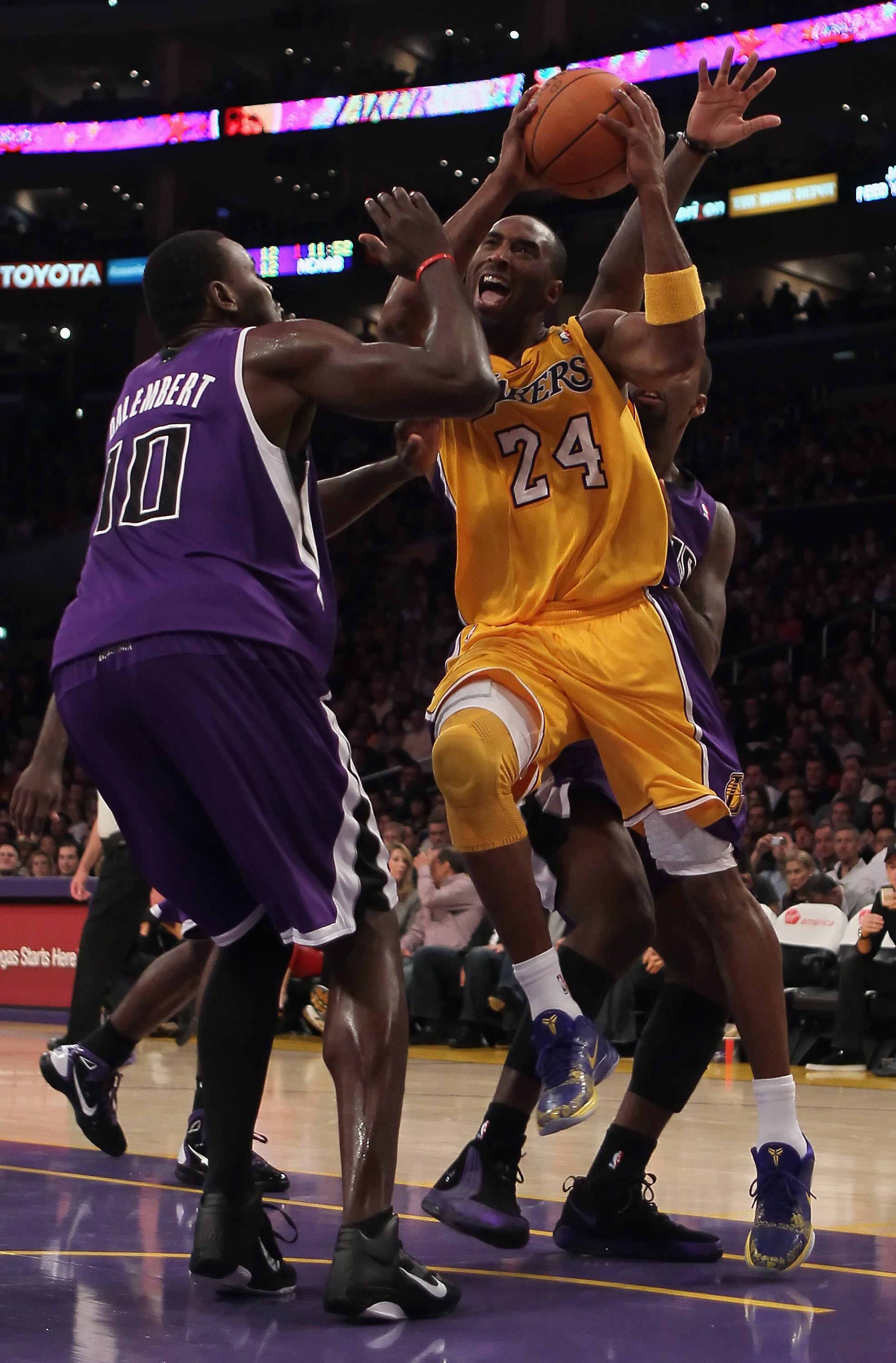 LOS ANGELES, CA - DECEMBER 03:  Kobe Bryant #24 of the Los Angeles Lakers drives to the basket while being defended by Samuel Dalembert #10 of the Sacramento Kings during the first half at Staples Center on December 3, 2010 in Los Angeles, California. The