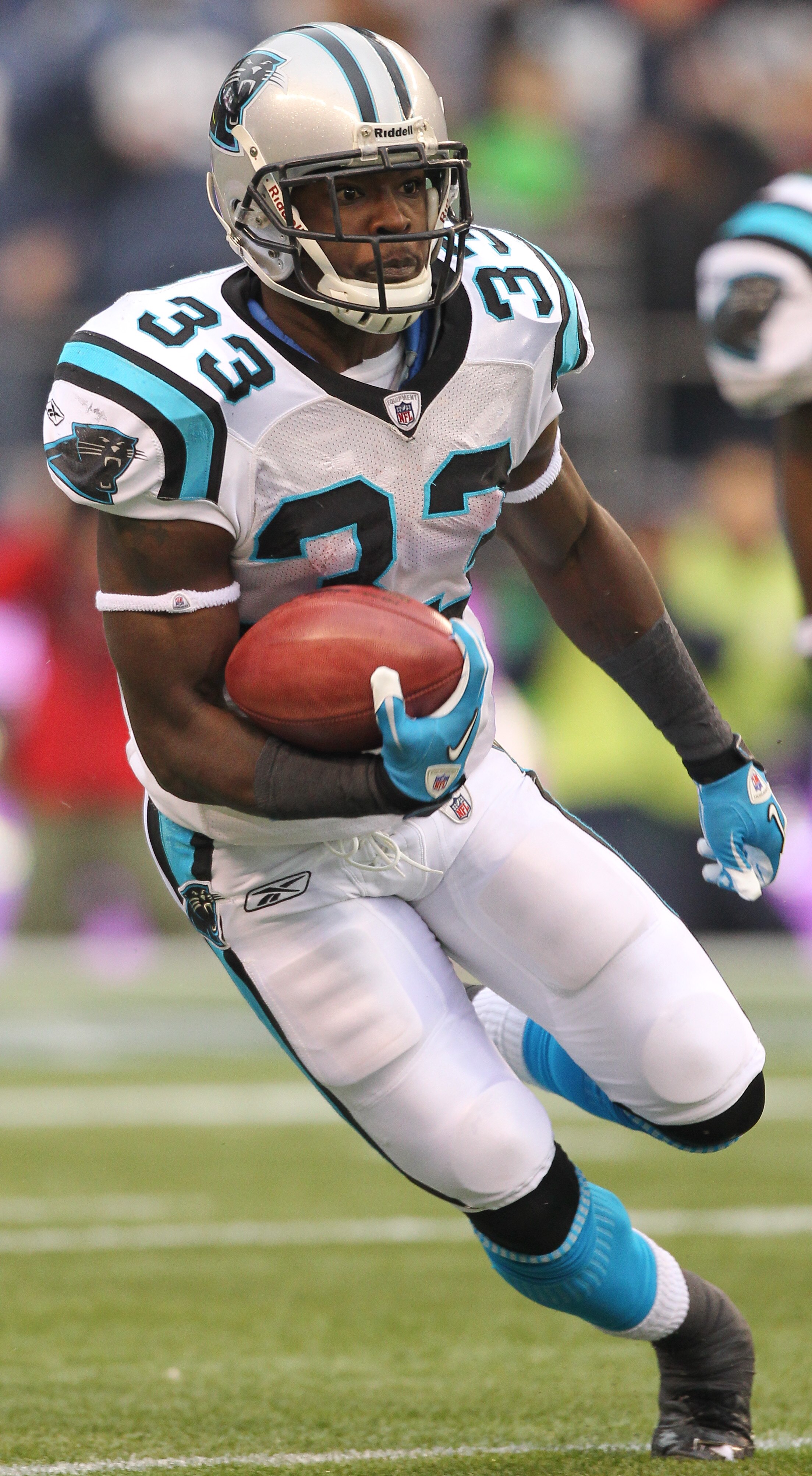 SEATTLE - DECEMBER 05:  Running back Mike Goodson #33 of the Carolina Panthers rushes against the Seattle Seahawks at Qwest Field on December 5, 2010 in Seattle, Washington. The Seahawks won, 31-14. (Photo by Otto Greule Jr/Getty Images)