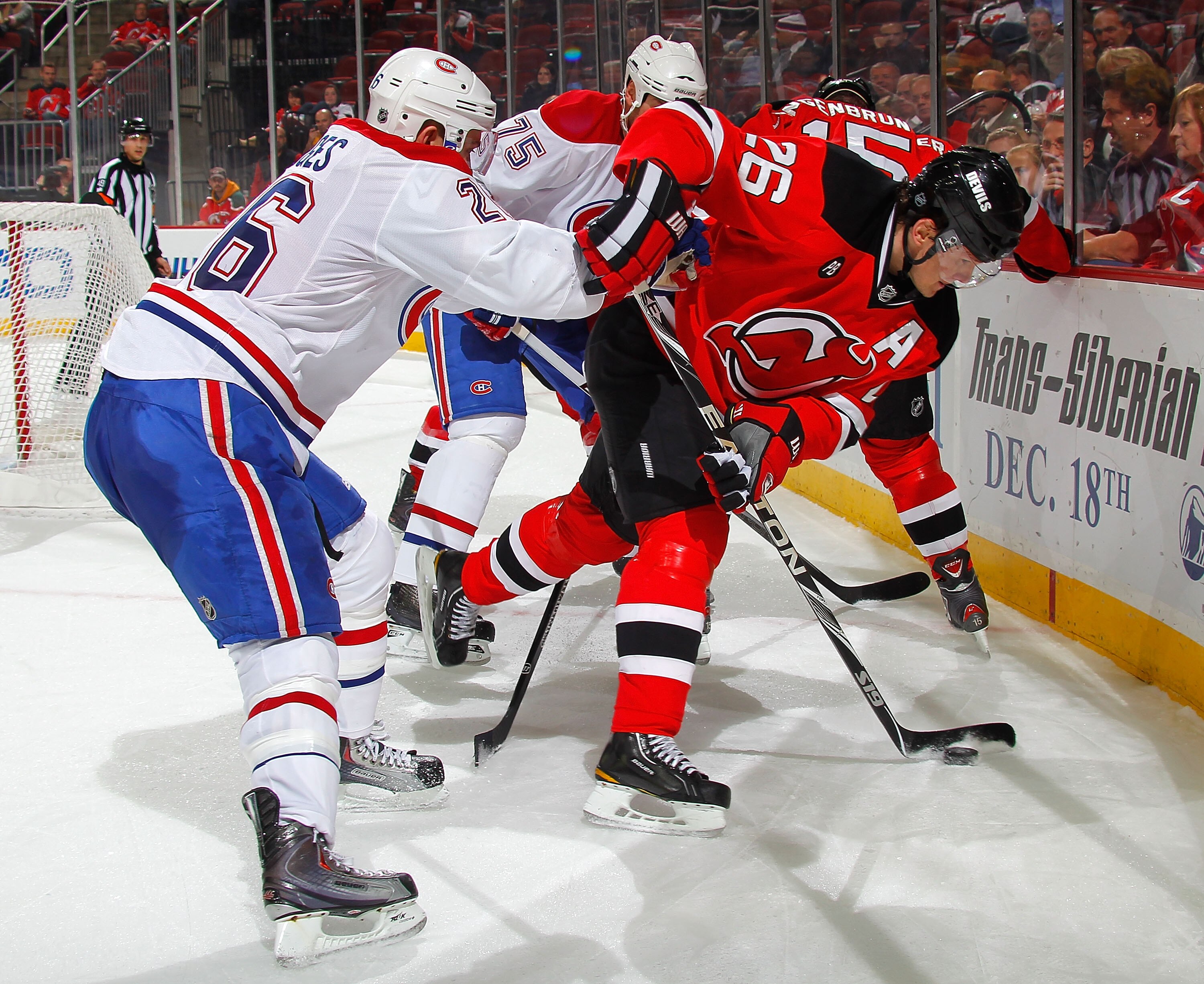 NEWARK, NJ - DECEMBER 02:  Josh Gorges #26 of the Montreal Canadiens checks Patrik Elias #26 of the New Jersey Devils during the second period of a hockey game at the Prudential Center on December 2, 2010 in Newark, New Jersey.  (Photo by Paul Bereswill/G