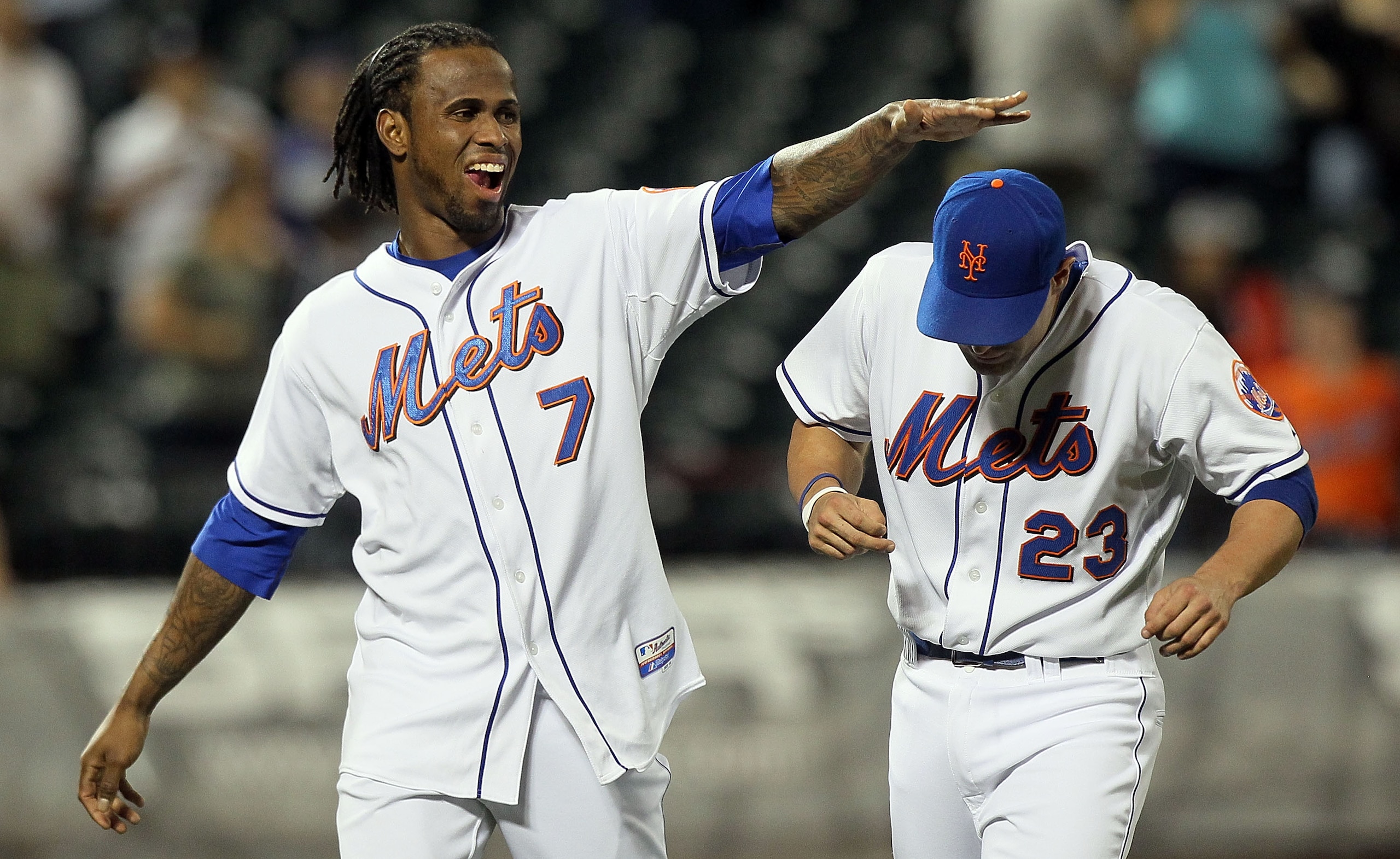 NEW YORK - AUGUST 27:  Jose Reyes #7 of the New York Mets celebrates after defeating the Houston Astros with tyeammate Chris Carter #23 on August 27, 2010 at Citi Field in the Flushing neighborhood of the Queens borough of New York City. The Mets defeated