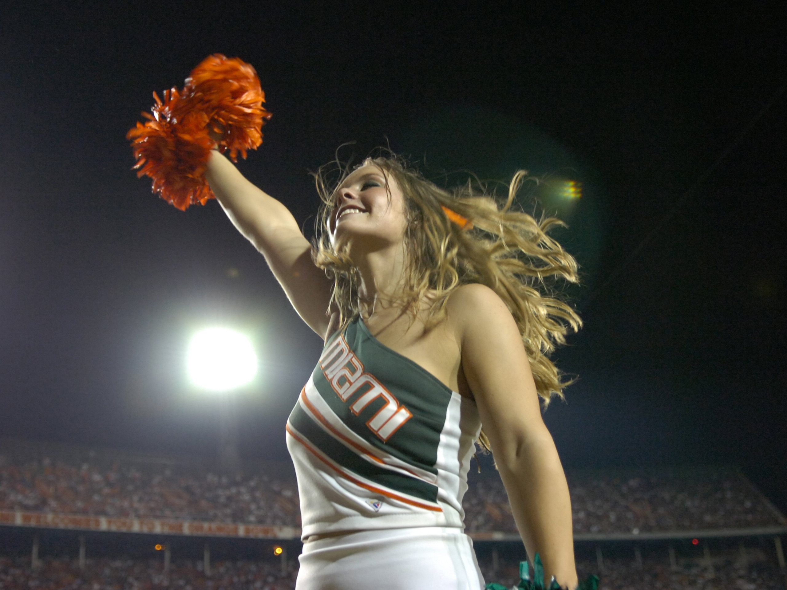 MIAMI, FL - SEPTEMBER 20: A  cheerleader from the University of Miami Hurricanes entertains during play against Texas A&M Aggies at the Orange Bowl on September 20, 2007 in Miami, Florida.  Miami won 31-17.  (Photo by Al Messerschmidt/Getty Images) *** Lo