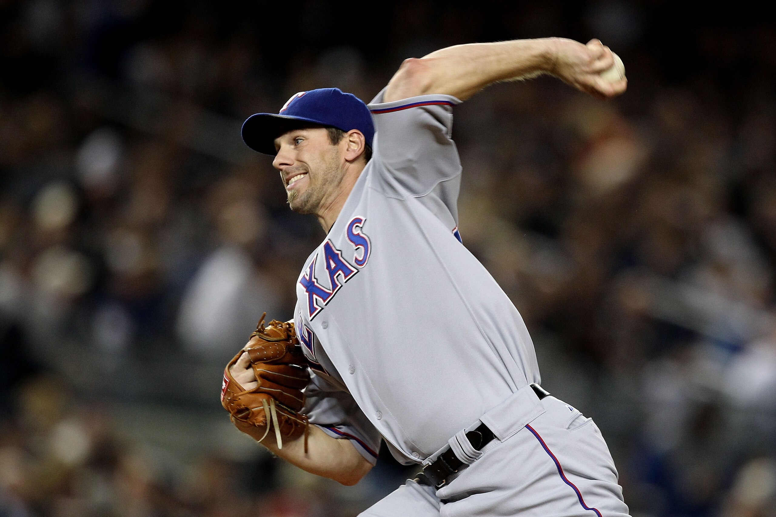 NEW YORK - OCTOBER 18:  Cliff Lee #33 of the Texas Rangers throws a pitch against the New York Yankees in Game Three of the ALCS during the 2010 MLB Playoffs at Yankee Stadium on October 18, 2010 in New York, New York. The Rangers won 8-0.  (Photo by Al B