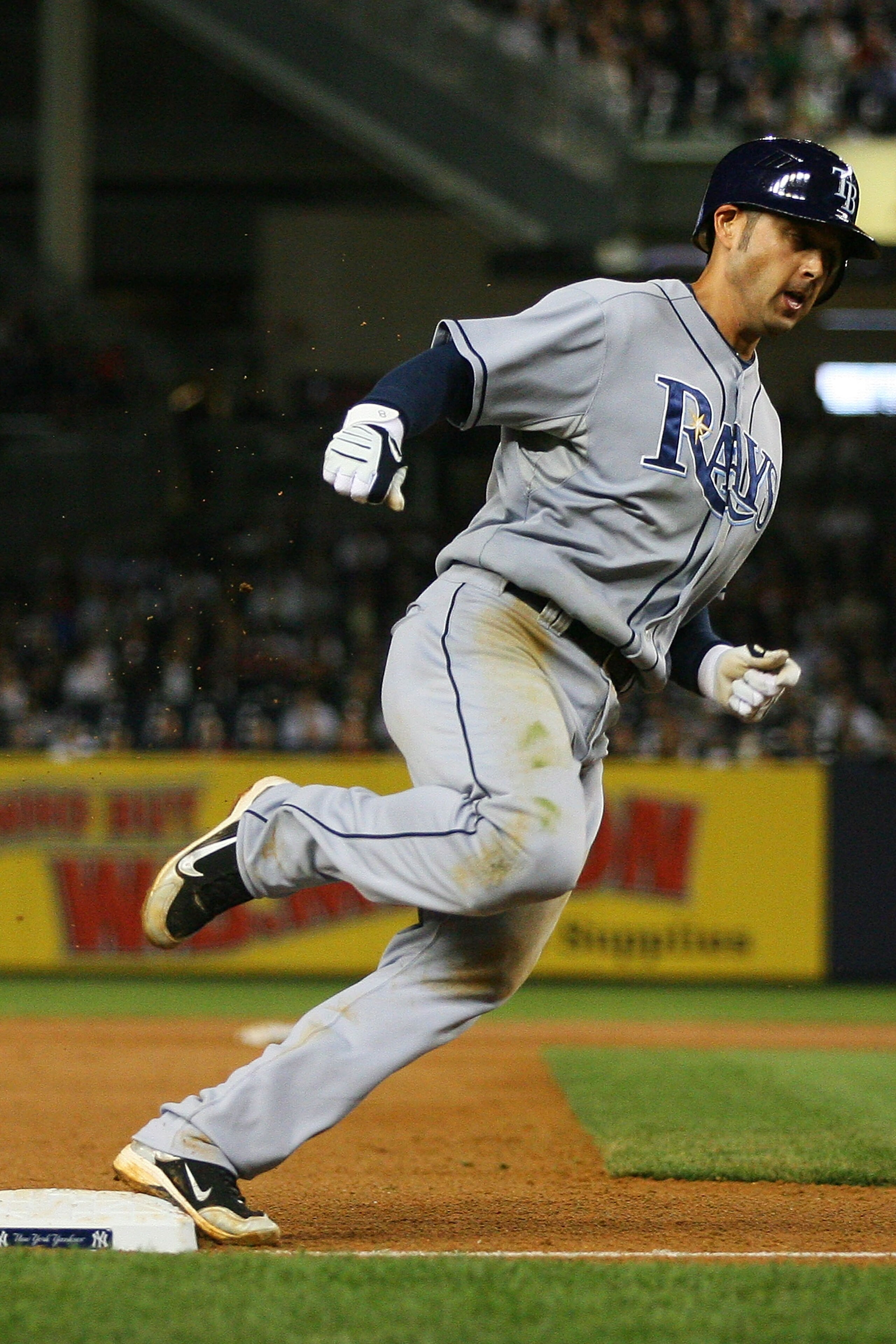 NEW YORK - SEPTEMBER 21:  Jason Bartlett #8 of the Tampa Bay Rays rounds third base on a one run single hit by Carl Crawford in the seventh inning against the Tampa Bay Rays on September 21, 2010 at Yankee Stadium in the Bronx borough of New York City.  T