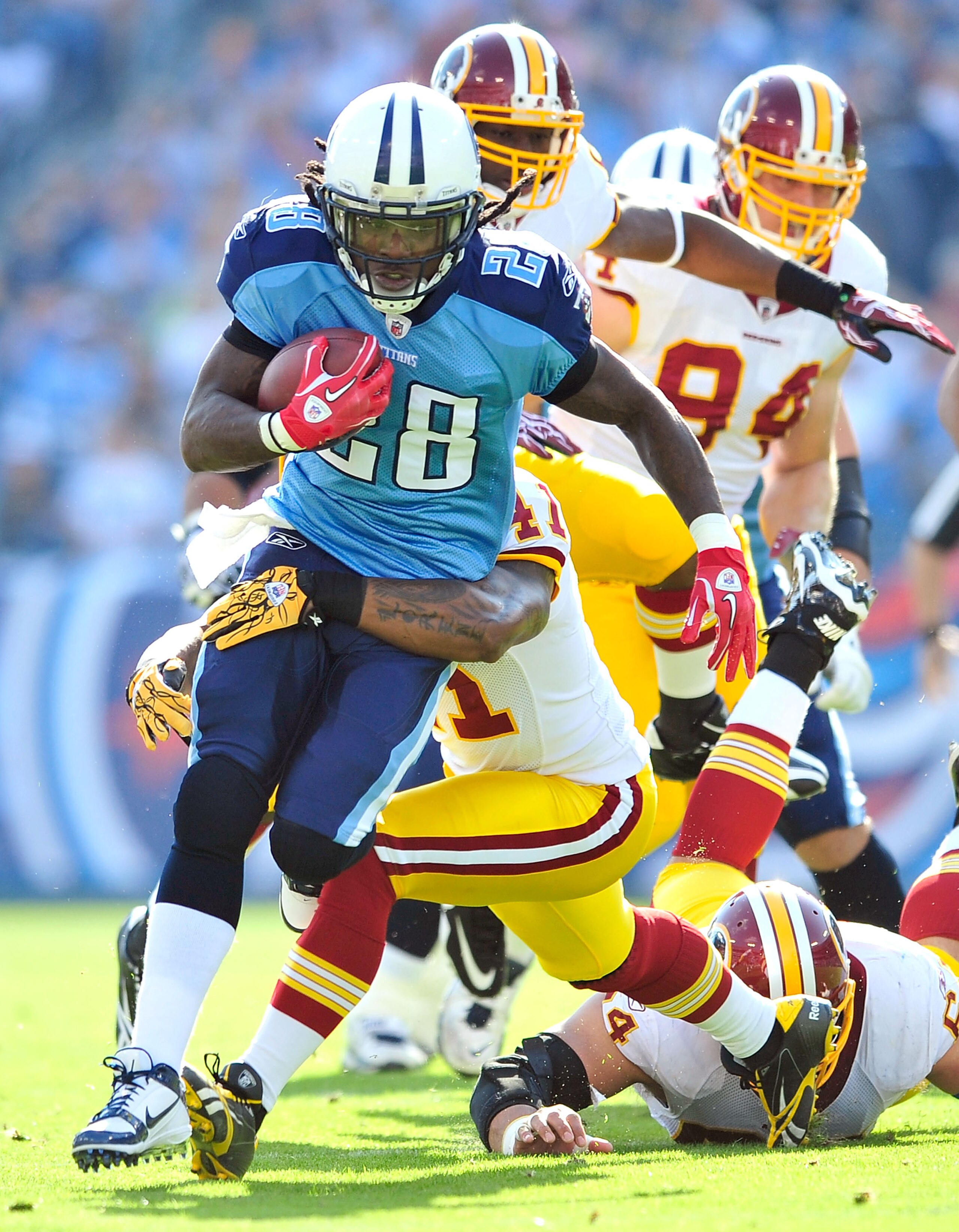 NASHVILLE, TN - NOVEMBER 21:  Kareem Moore #41 of the Washington Redskins tackles Chris Johnson #28 of the Tennessee Titans during the first half at LP Field on November 21, 2010 in Nashville, Tennessee.  (Photo by Grant Halverson/Getty Images)